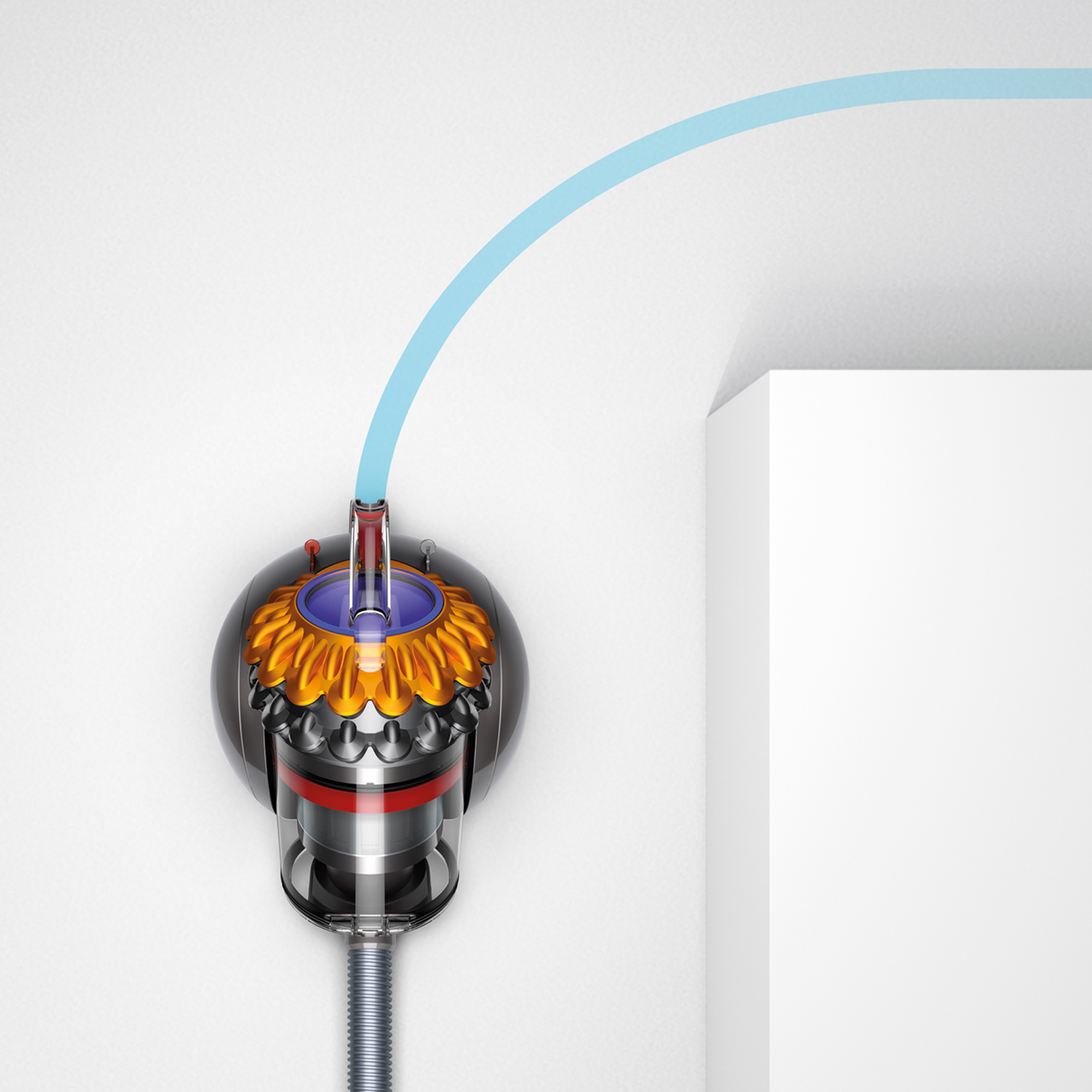Dyson süpürgenin kesiti. Mavi boru duvardan cihaza doğru yay çiziyor. Cihaz siyah, altın ve gümüş renkli.
