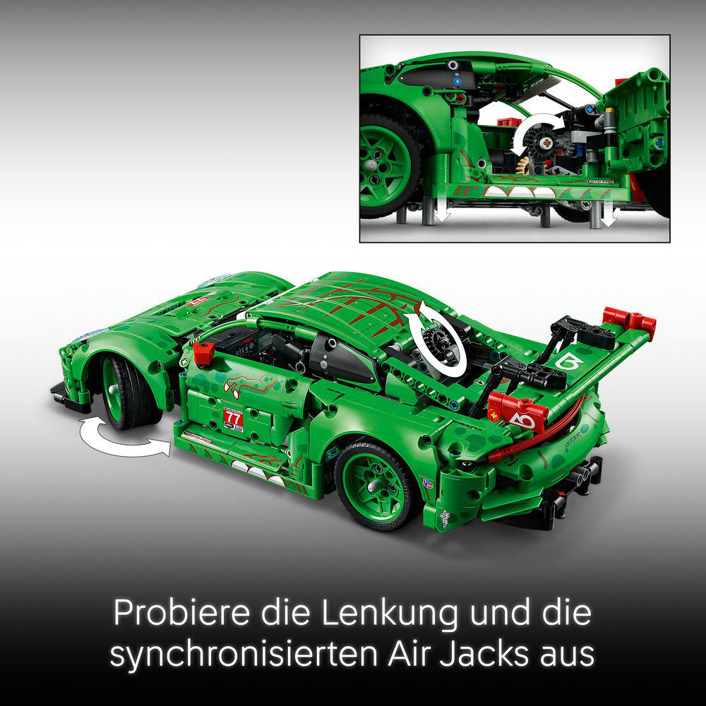 Grünes Spielzeugauto mit offener Tür, das Innenmechanismen zeigt. Text unten. Ein weißer Pfeil zeigt die Lenkung.