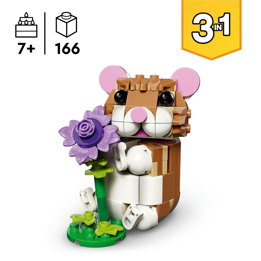 Eine Lego-Hamsterfigur, die eine lila Blume hält. Er ist braun und weiß mit rosa Ohren und schwarzen Augen. Er sitzt auf einer grünen Basis.