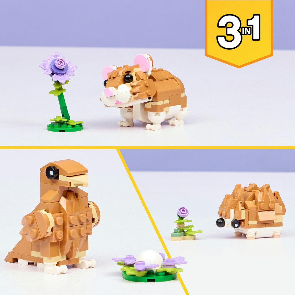 Das Bild zeigt Lego-Tiere: Hamster, Vogel, Igel und eine Blume. Es gibt auch ein Nest mit einem Ei. Sie alle sind auf einer weißen Oberfläche.