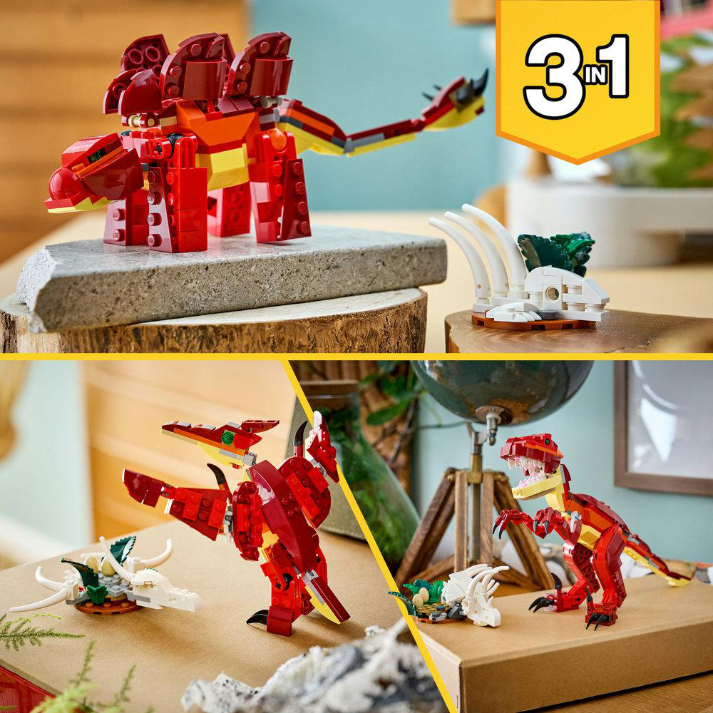Das Bild zeigt LEGO-Dinosaurier-Modelle. Ein roter Dinosaurier befindet sich auf einer Holzoberfläche, ein weiterer roter Dinosaurier in der unteren rechten Ecke.