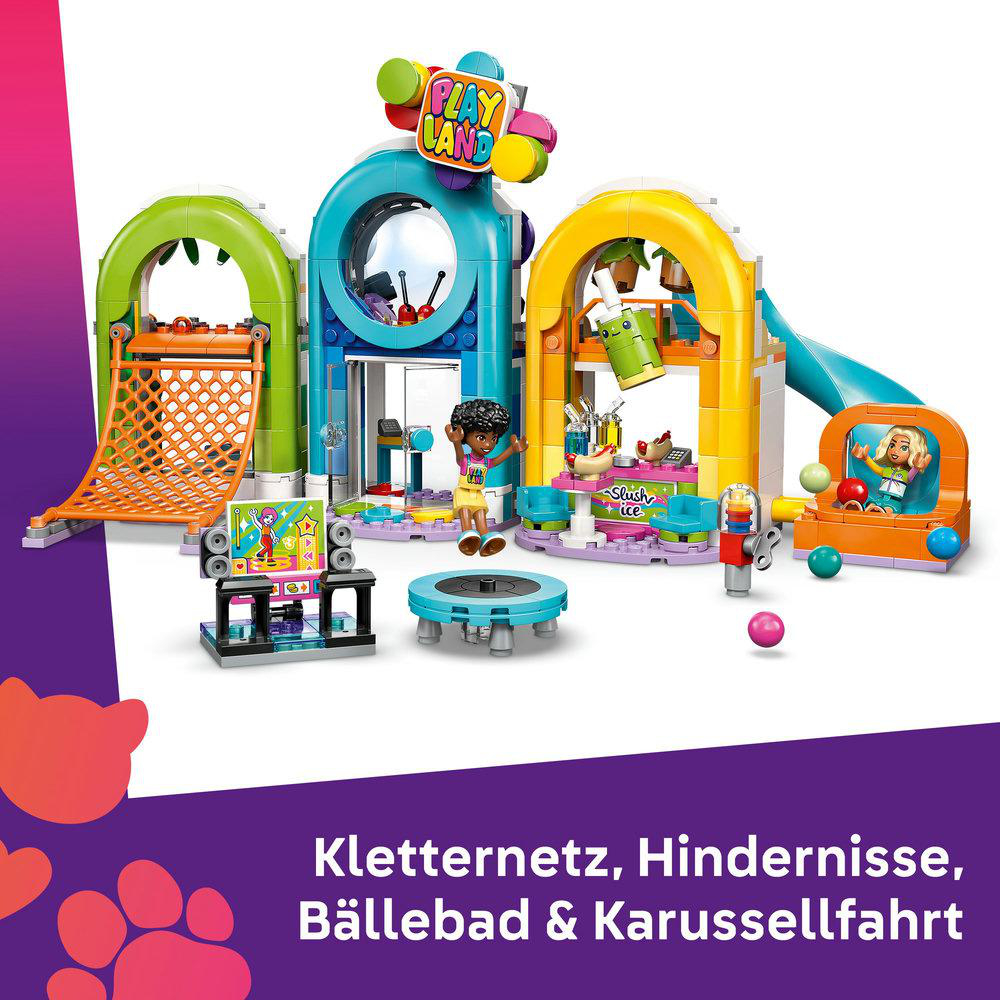Buntes Spielplatz-Set mit Kletternetzen, Hindernissen, Bällebad und Karussell. Enthält Figuren und ein 'Play Land'-Schild.