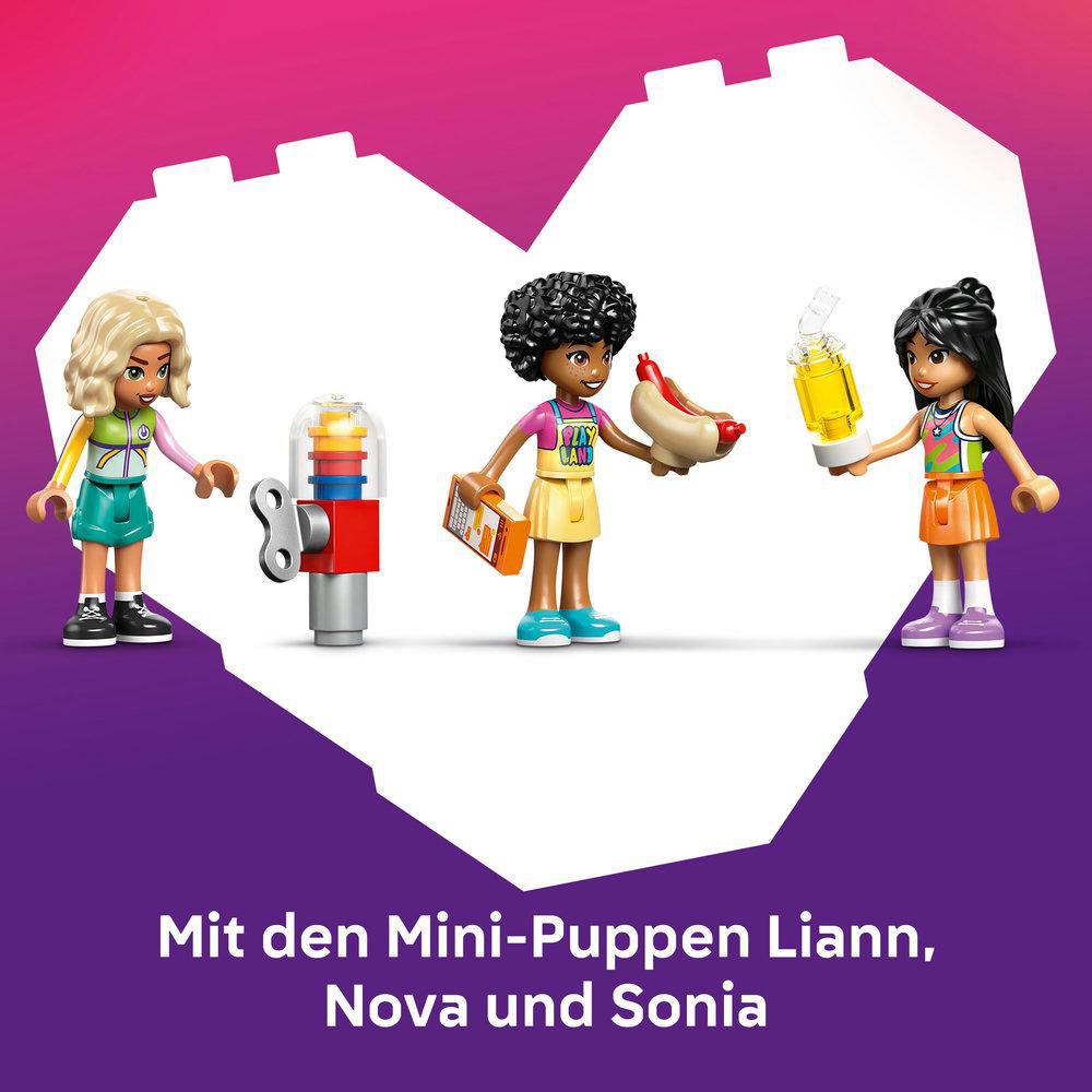 Drei Lego-Minifiguren halten Getränk, Hotdog und Speisekarte. In der Mitte steht eine rote und silberne Maschine. Lila und rosa Hintergrund.