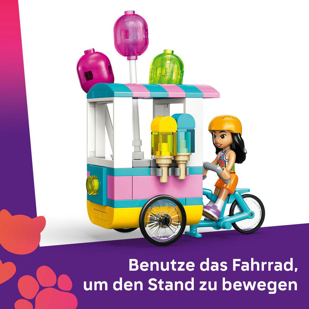 Ein Mädchen auf einem Fahrrad zieht einen bunten Eiswagen. Der Wagen hat eiscremeartige Dekorationen und Text darunter.