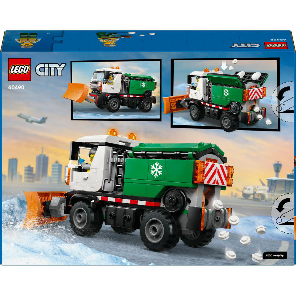 LEGO City Schneepflug. Weißes Fahrerhaus, grünes Bett, orangefarbener Pflug. Das Set enthält ein Flugzeug und Gebäude im Hintergrund.