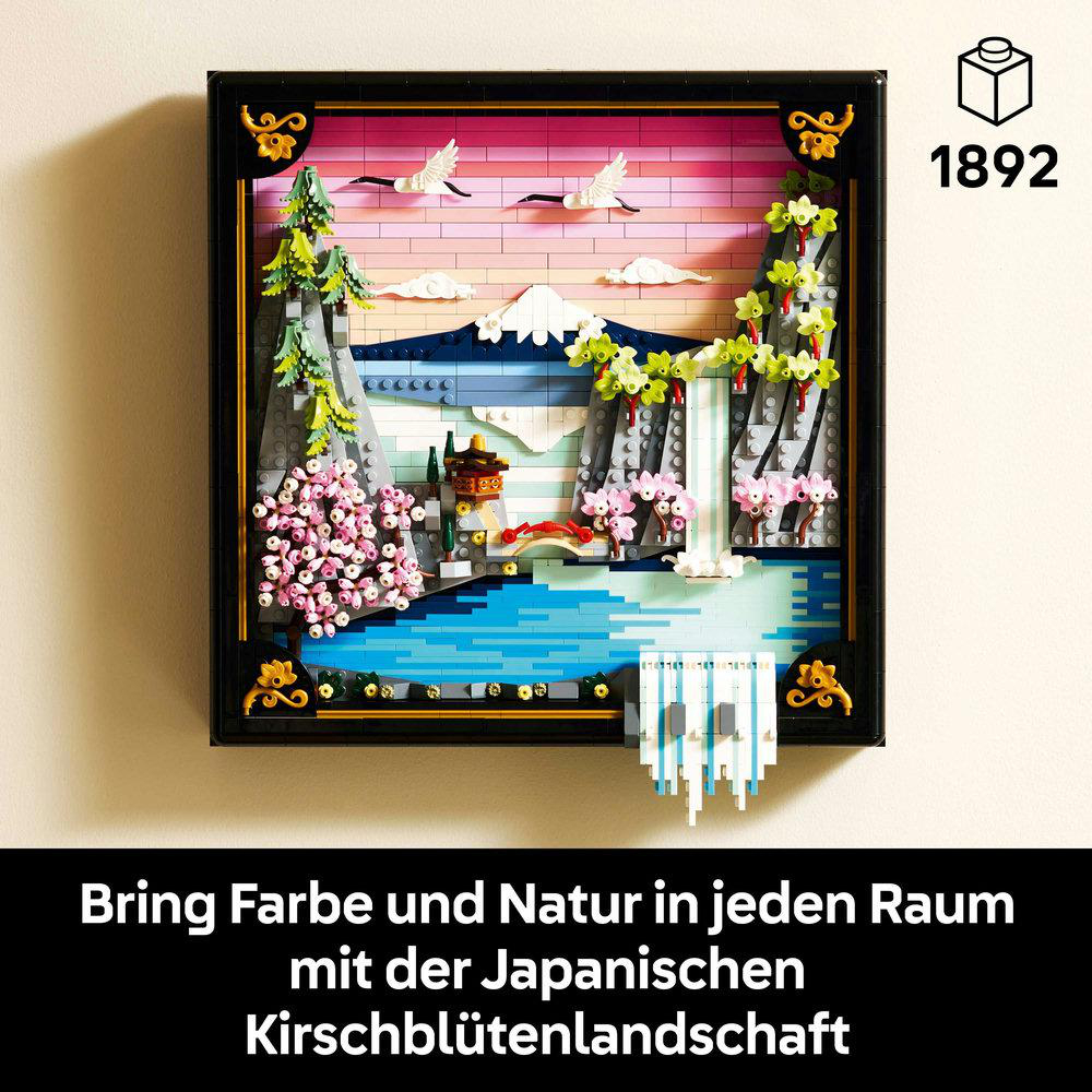 Lego japanische Gartenszene. Rosa Kirschblütenbäume, Wasserfall, Brücke und fliegende Vögel vor Sonnenuntergang. Gerahmt.