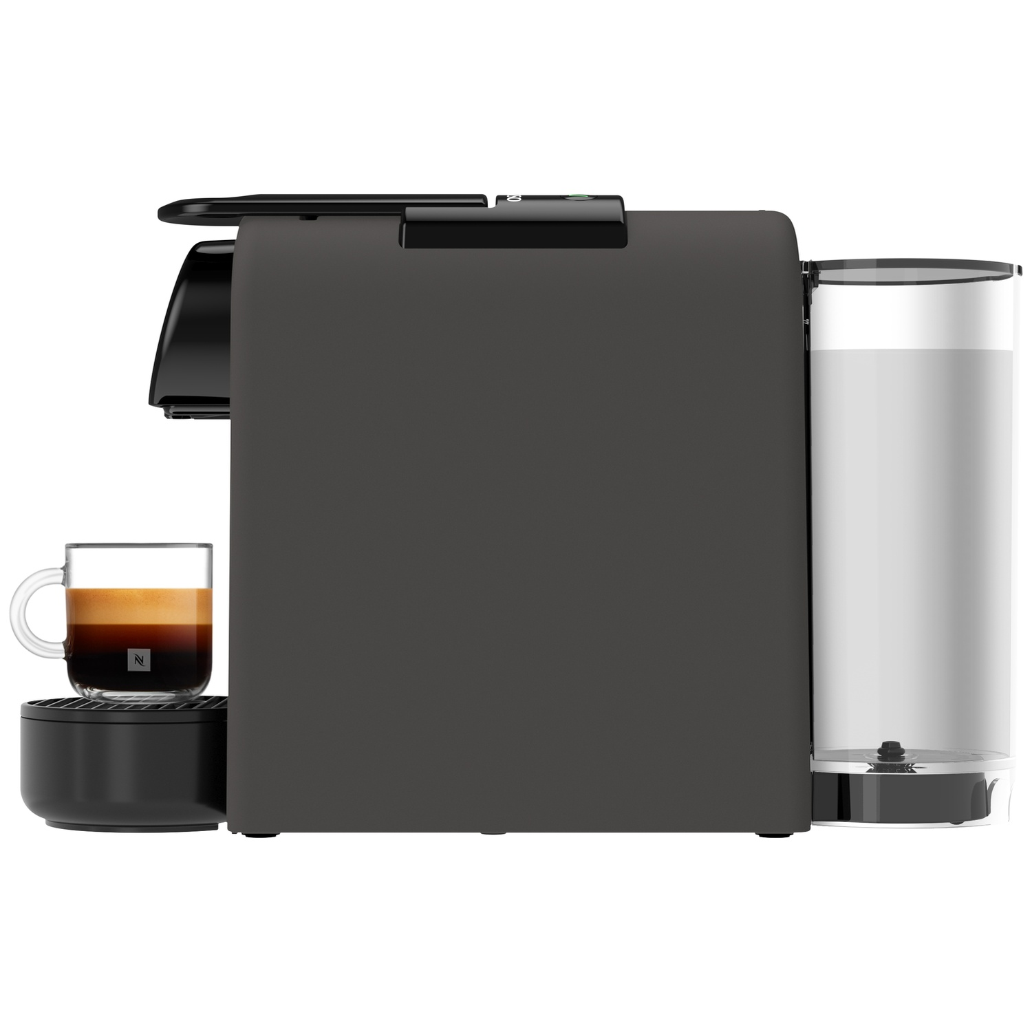 A dark gray Nespresso coffee machine with a glass of espresso. A milk container is on the right.