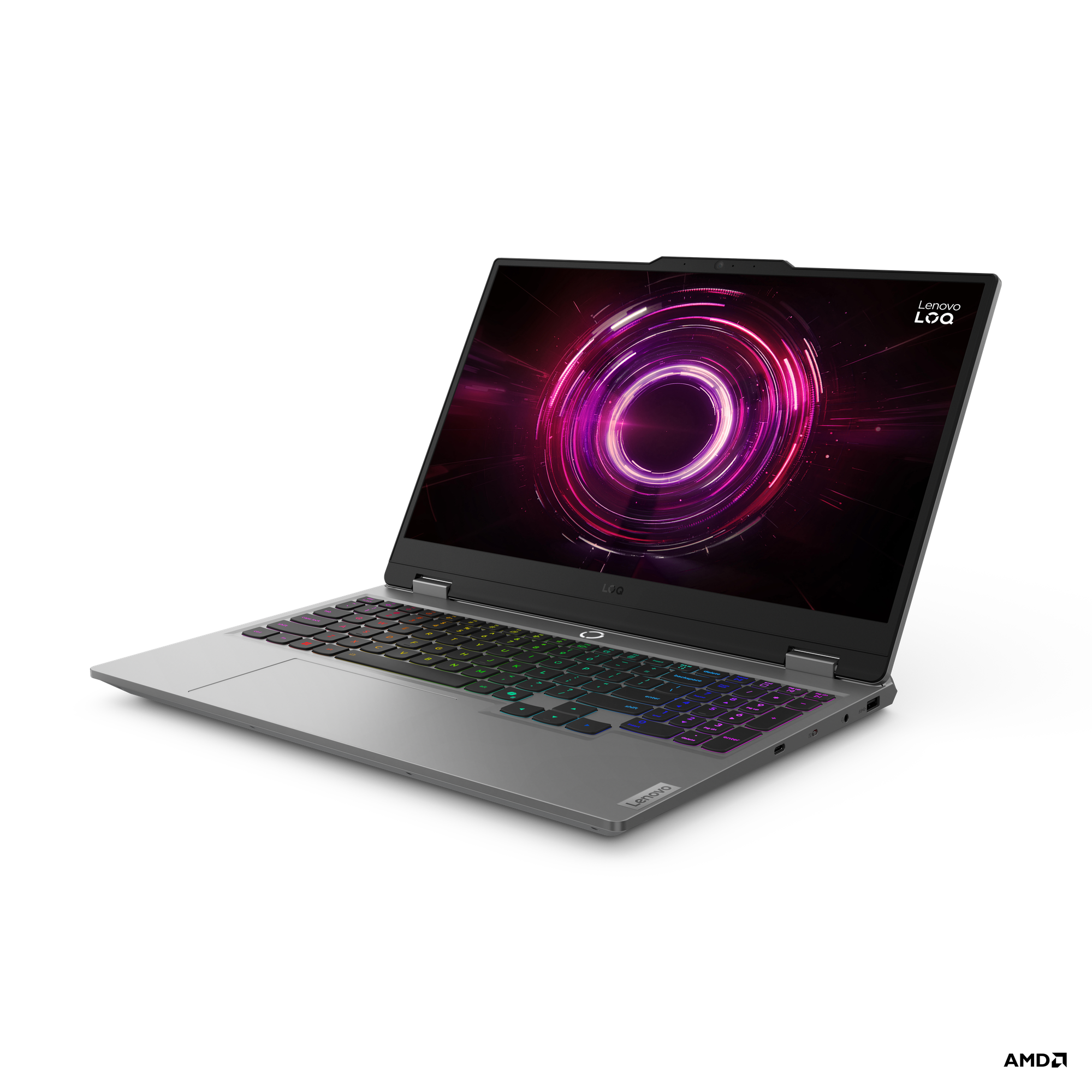 Bir Lenovo LoQ dizüstü bilgisayar açık. Ekran, parlayan mor ve pembe bir tasarım sergiliyor. Klavye, gökkuşağı renkleriyle arkadan aydınlatmalı.