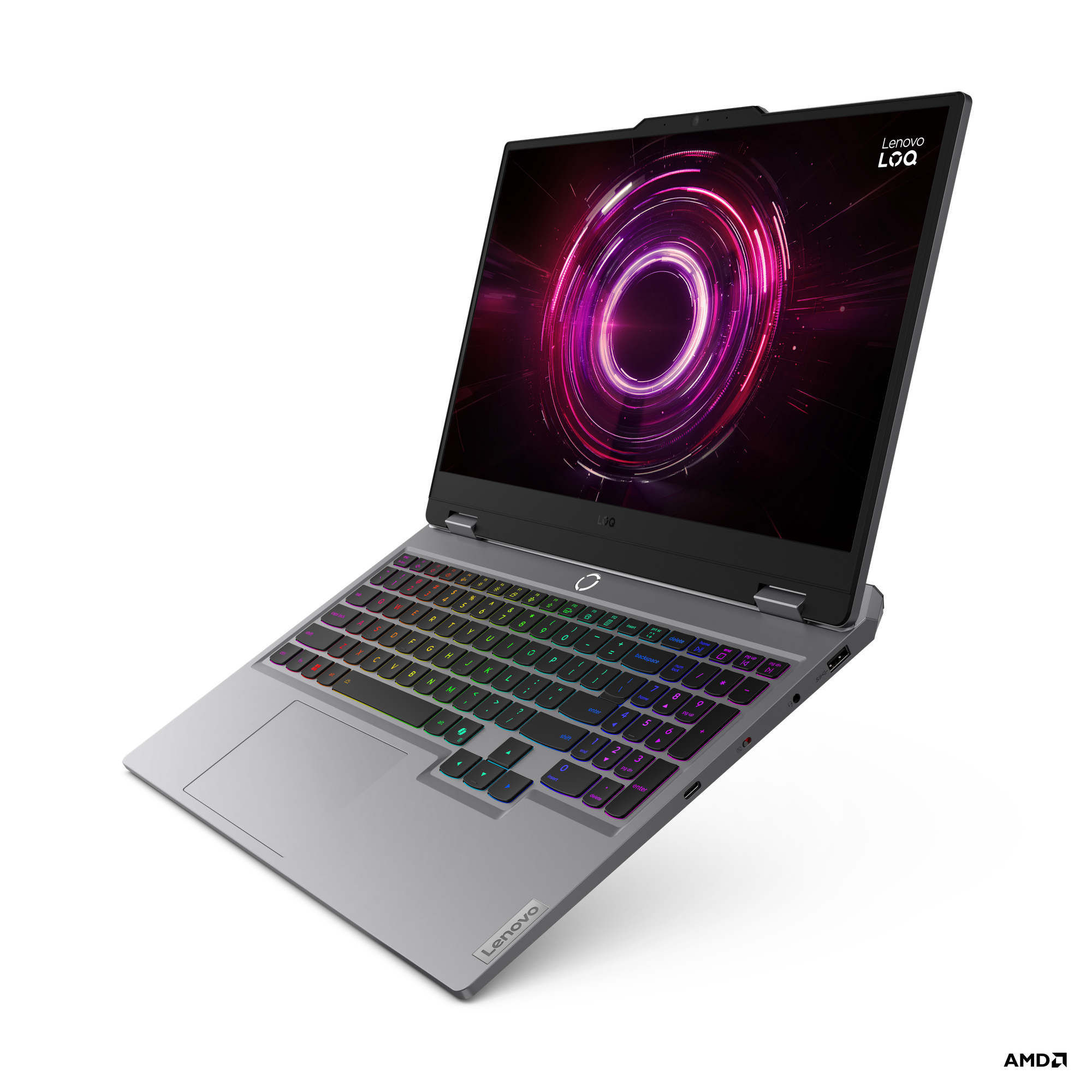 Bir Lenovo dizüstü bilgisayar, renkli bir klavye ve dairesel bir tasarım sergileyen bir ekran gösteriyor. Dizüstü gri renkli.