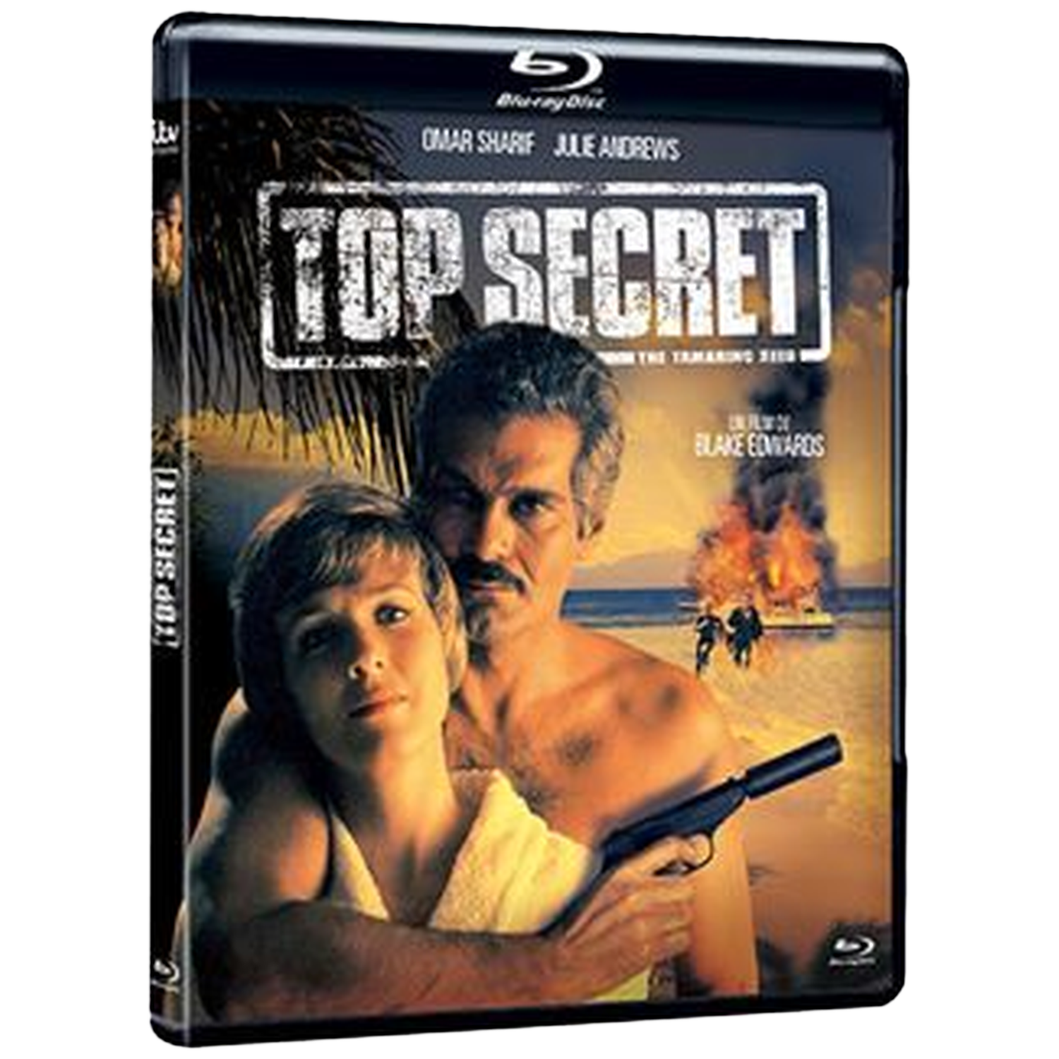 Couverture de DVD. Un homme et une femme s'embrassent. L'homme tient une arme. Le fond montre du feu et deux personnages en course.