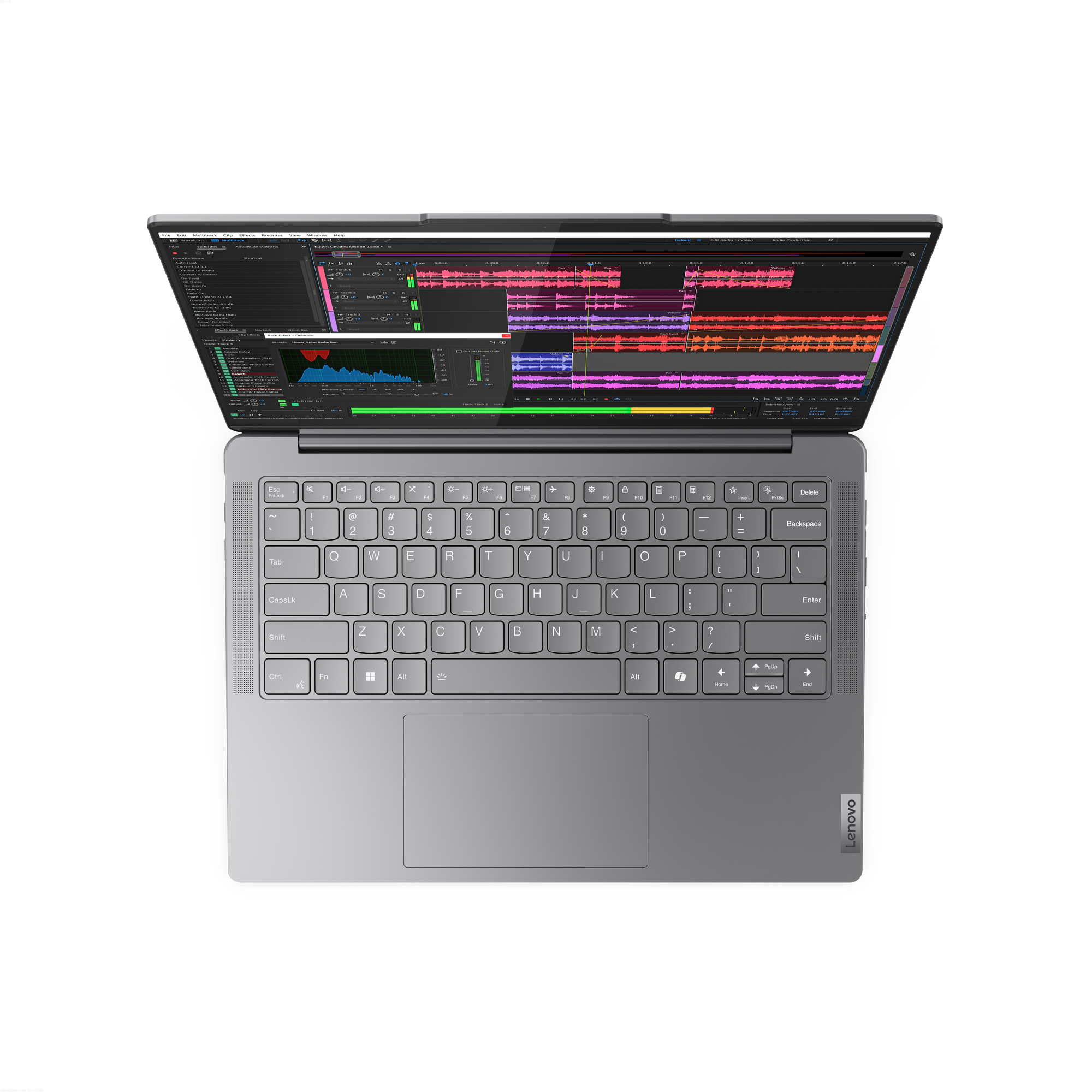 Siyah zemin üzerinde dizüstü bilgisayar. Ekran, ses düzenleme yazılımı arayüzünü gösteriyor. Klavye ve dokunmatik yüzey görünür. Lenovo logosu.