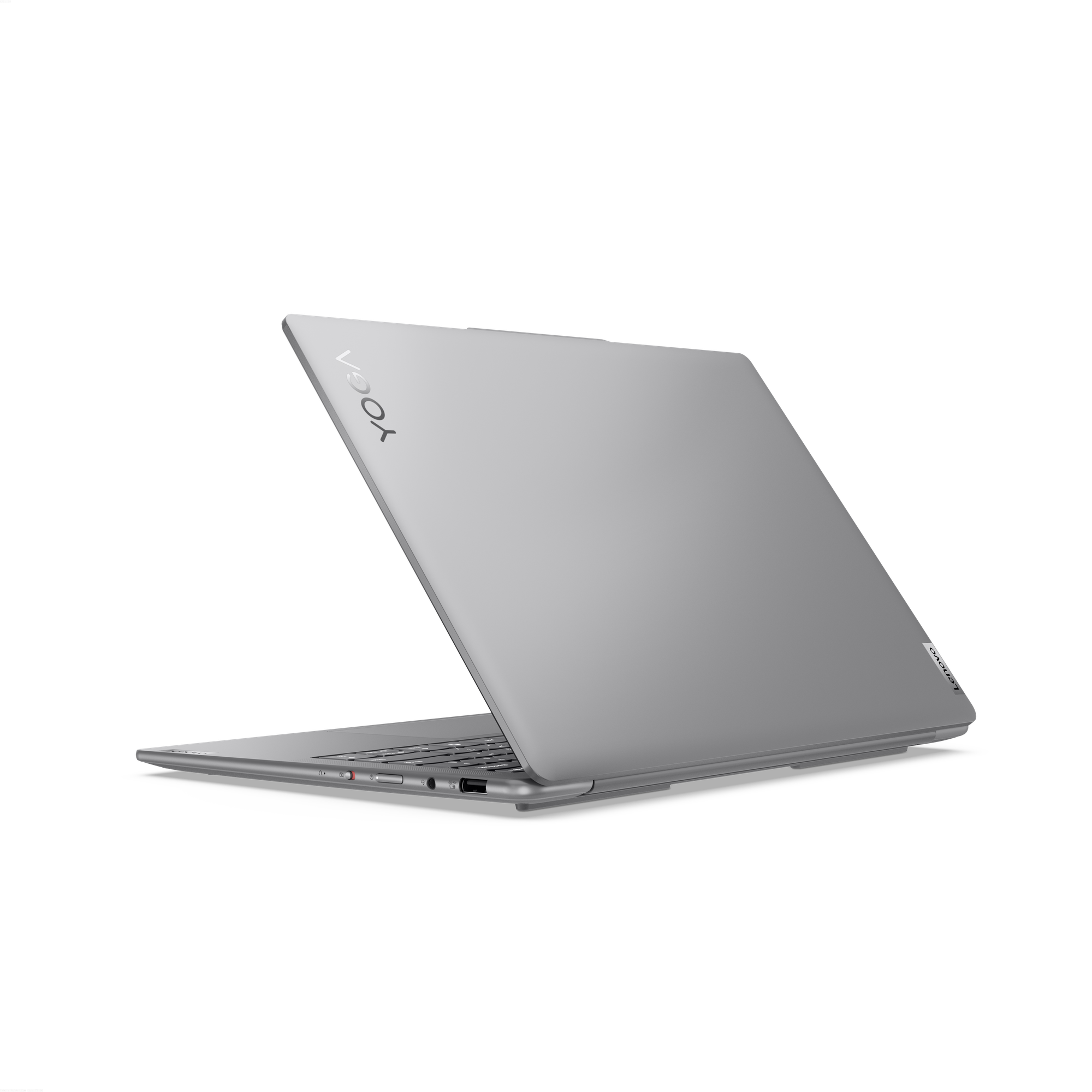 Siyah arka plan önünde kısmen açık, gümüş renkli Lenovo Yoga dizüstü bilgisayar. 'YOGA' kelimesi görünür.