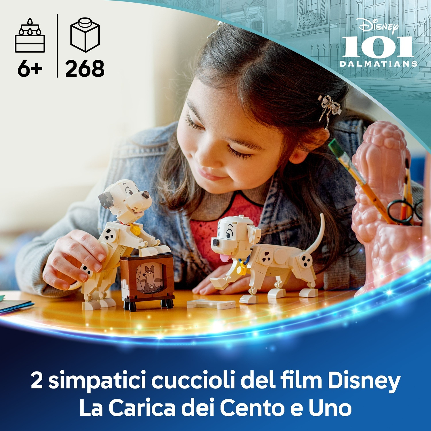 Una bambina gioca con i cuccioli dalmata Lego. Un cucciolo ha una piccola TV. Lo sfondo mostra il logo Disney 101 Dalmatians.