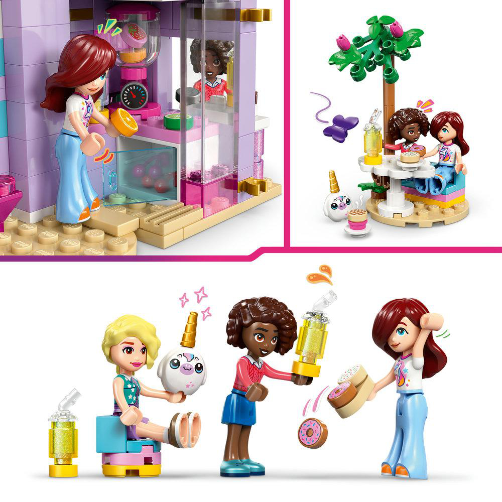 Lego-Set mit mehreren Figuren, die mit Essen und einem Gebäude interagieren. Helle Farben, Pink, Lila und Beige dominieren die Szene.