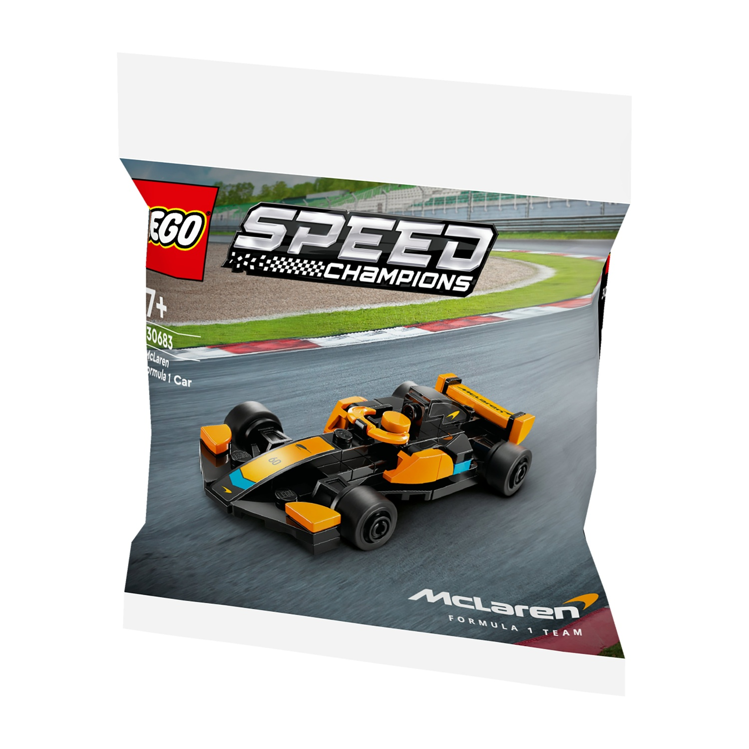 Un giocattolo Lego McLaren Formula 1 in una busta. L'auto è nera e arancione, con il logo McLaren sulla busta.