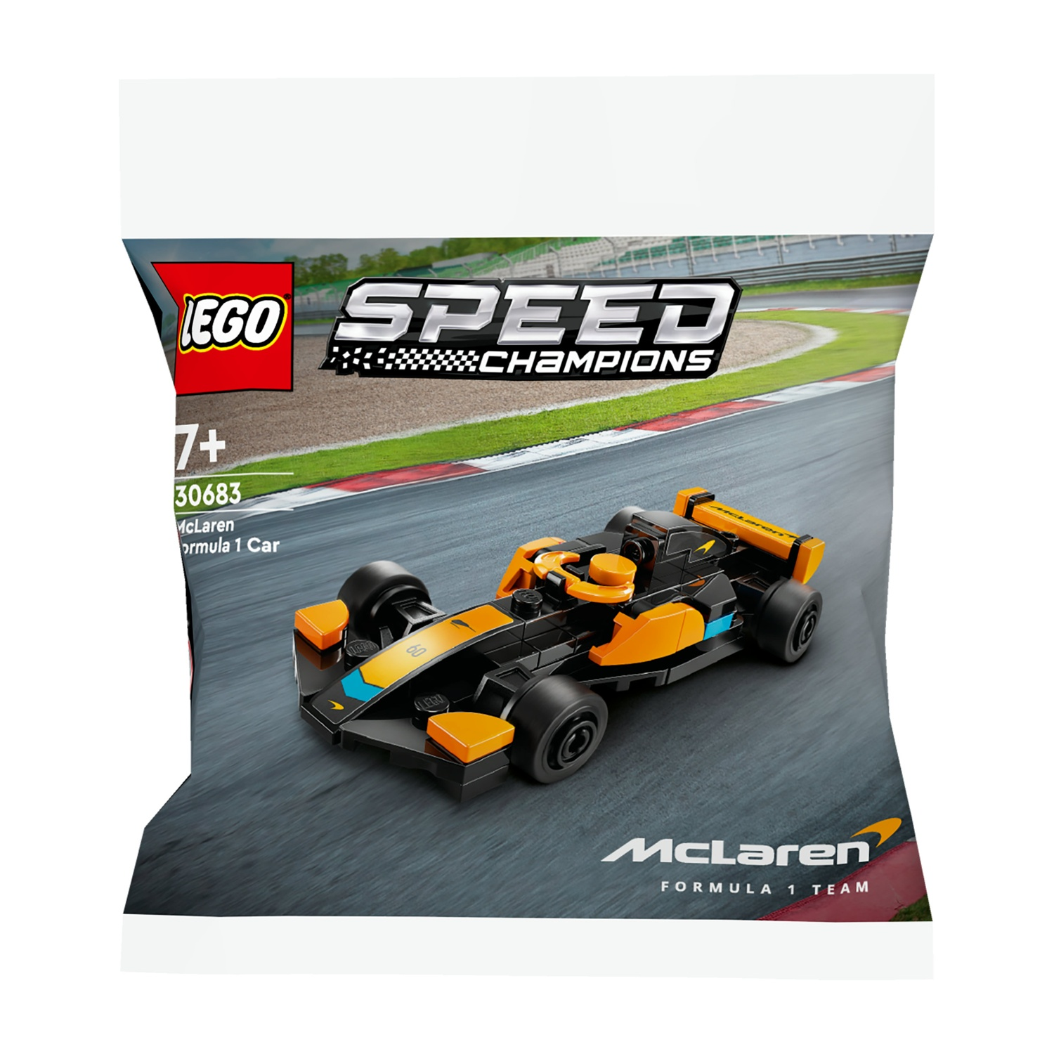 Un'auto Lego McLaren di Formula 1 in una busta. L'auto è nera e arancione, con il logo McLaren visibile.