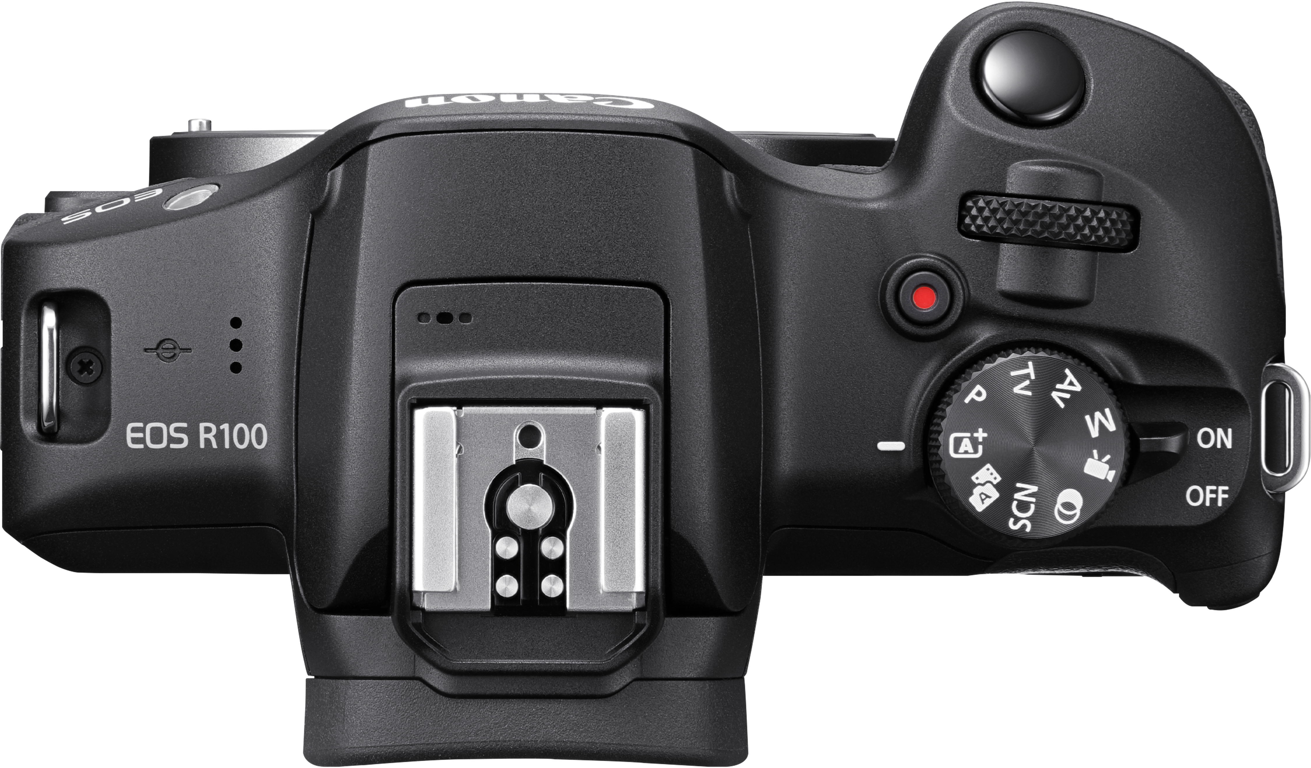 Vue de dessus d'un appareil photo Canon EOS R100 noir. Il comporte divers cadrans, boutons et une monture de flash. L'interrupteur d'alimentation est visible.