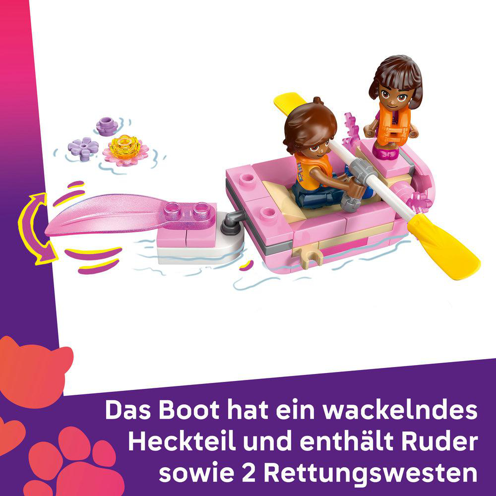 Ein rosafarbenes Spielzeugboot mit zwei Figuren, einem gelben Ruder und einigen Blumen. Eine Figur rudert, die andere trägt eine orangefarbene Schwimmweste.
