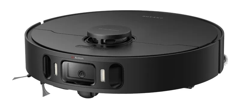 Czarny robot sprzątający na białej powierzchni. Posiada kamerę, czujniki i obrotowe szczotki. Design jest nowoczesny.