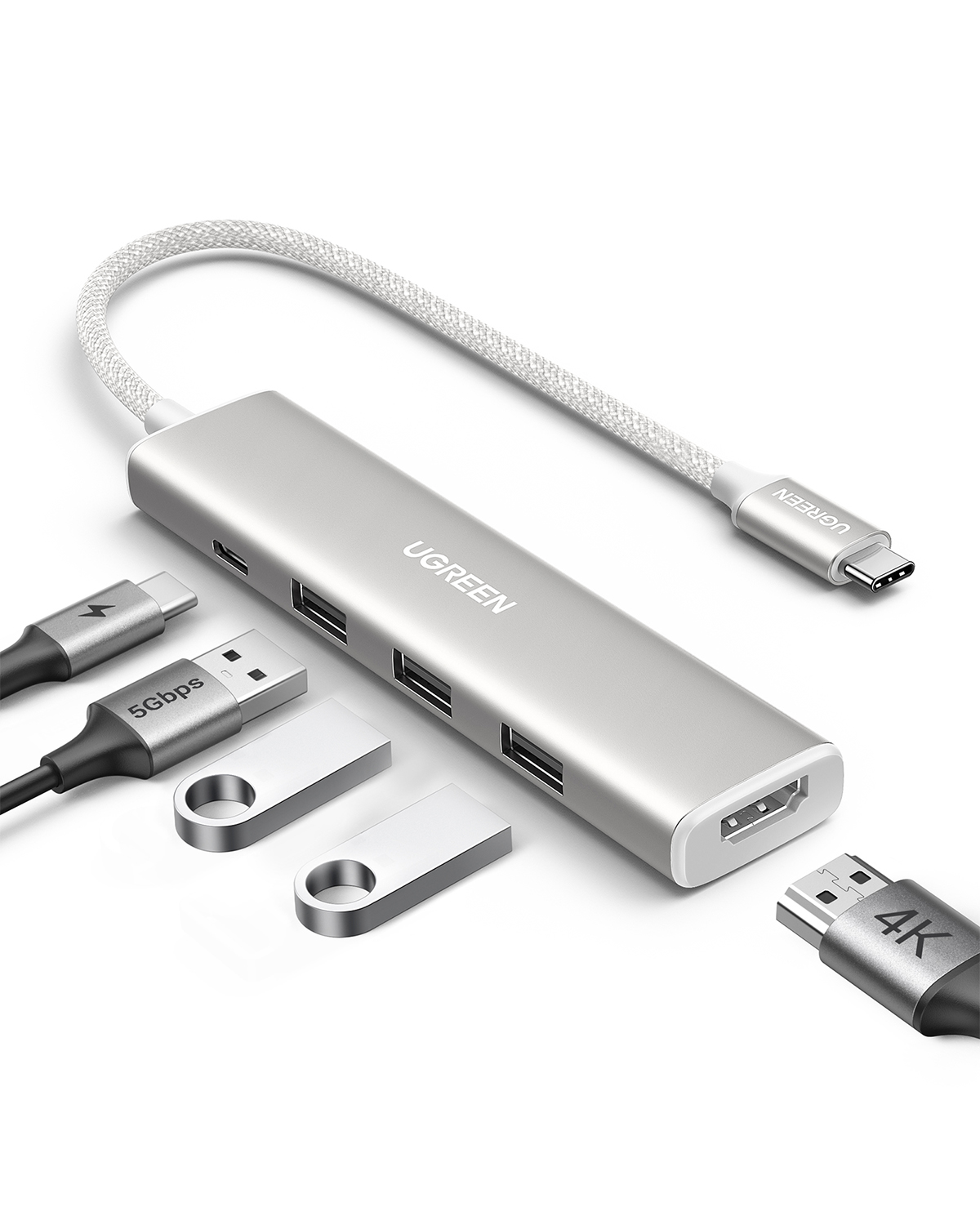 Gümüş UGREEN USB hub, çoklu portlar, USB sürücüler ve kablolar. HDMI, USB-C ve USB-A konektörleri içerir.