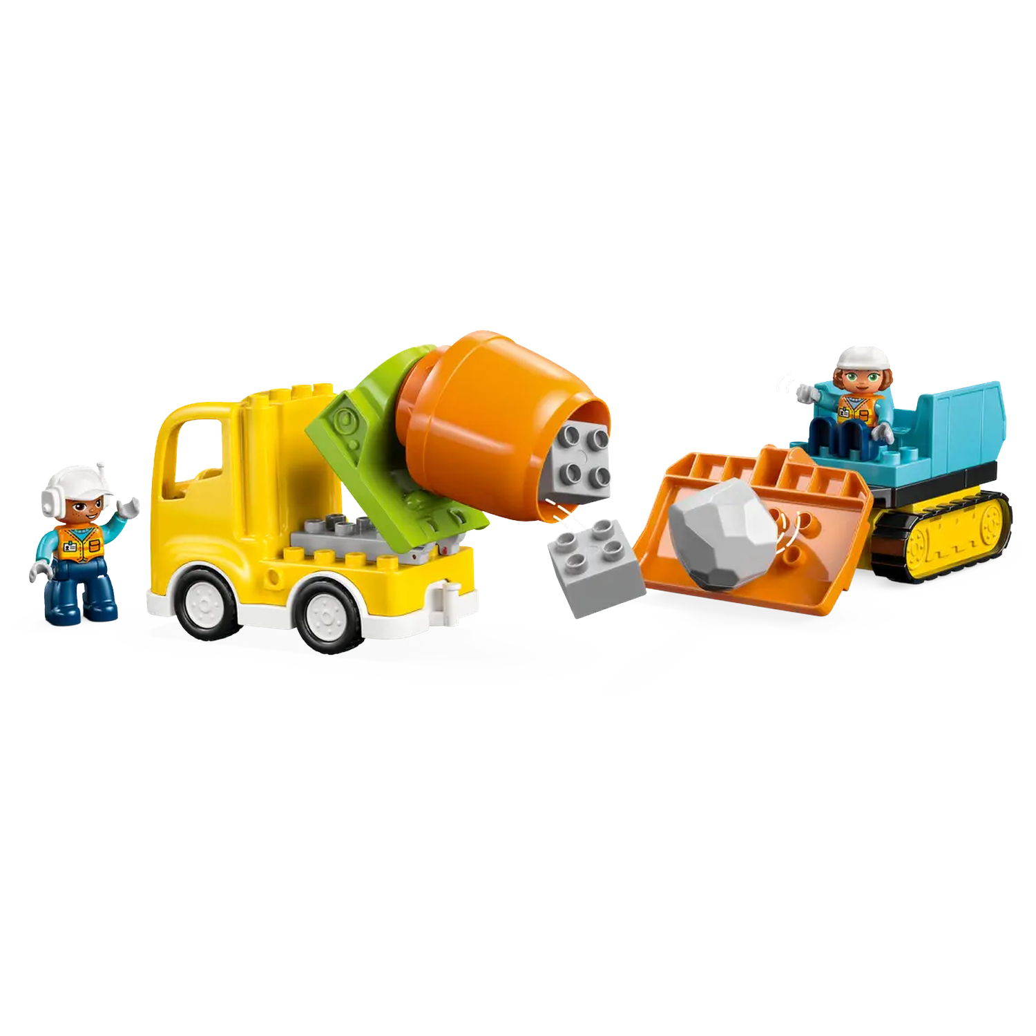 A construction scene with toy trucks, workers, and building blocks. A yellow truck and a blue digger are present. Workers are standing.