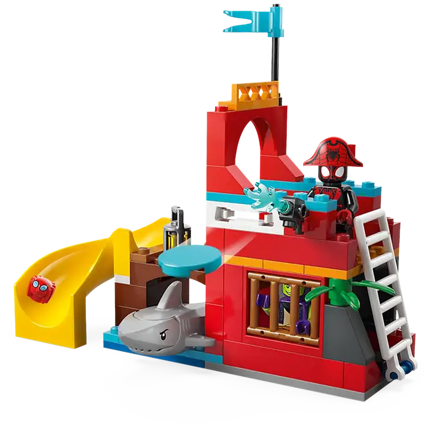 A Lego pirate ship playset. Features a red building with a slide, shark, ladder, and a Spider-Man figure in a pirate hat.