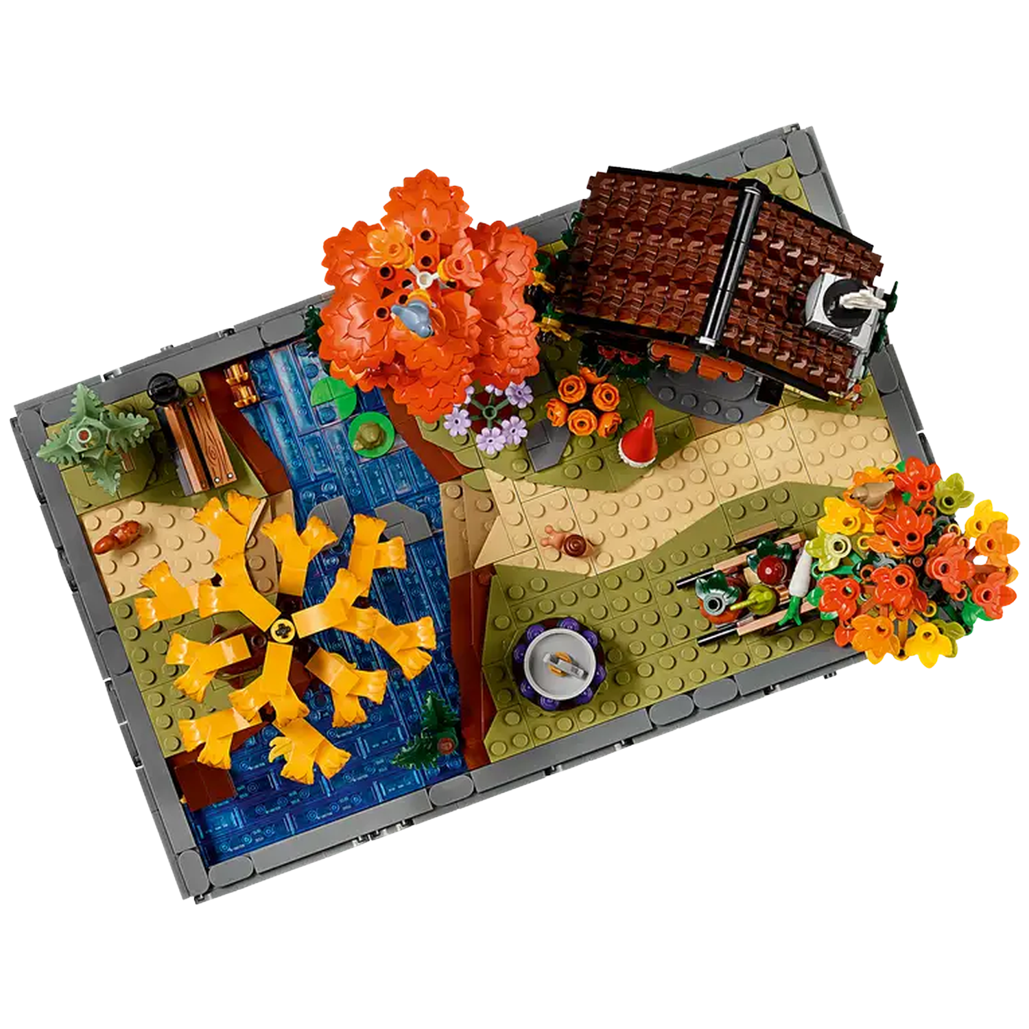 A Lego diorama features a house, river, trees, and flowers. Colors include brown, orange, yellow, and green. Scene has a miniature garden.
