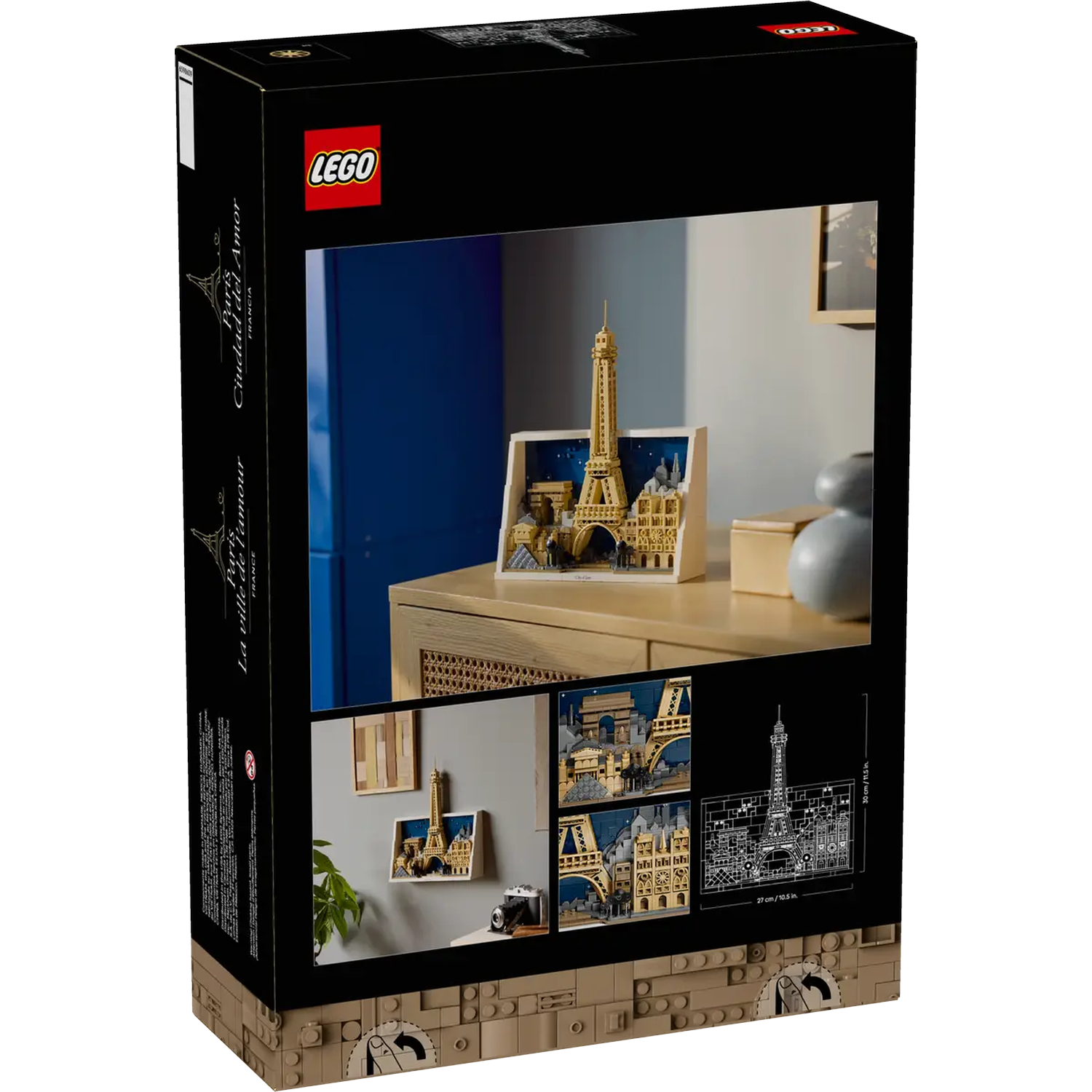 A LEGO box shows a built Eiffel Tower model. The box is black with images of the model and the Lego logo. 