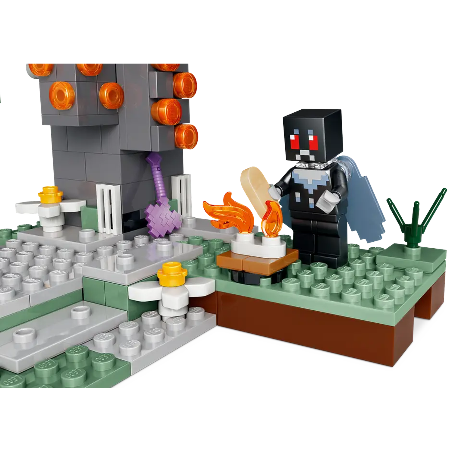 Minecraft Lego set. A figure with a cape, holding a blade, stands by a fire. A gray structure with orange lights is in the background.