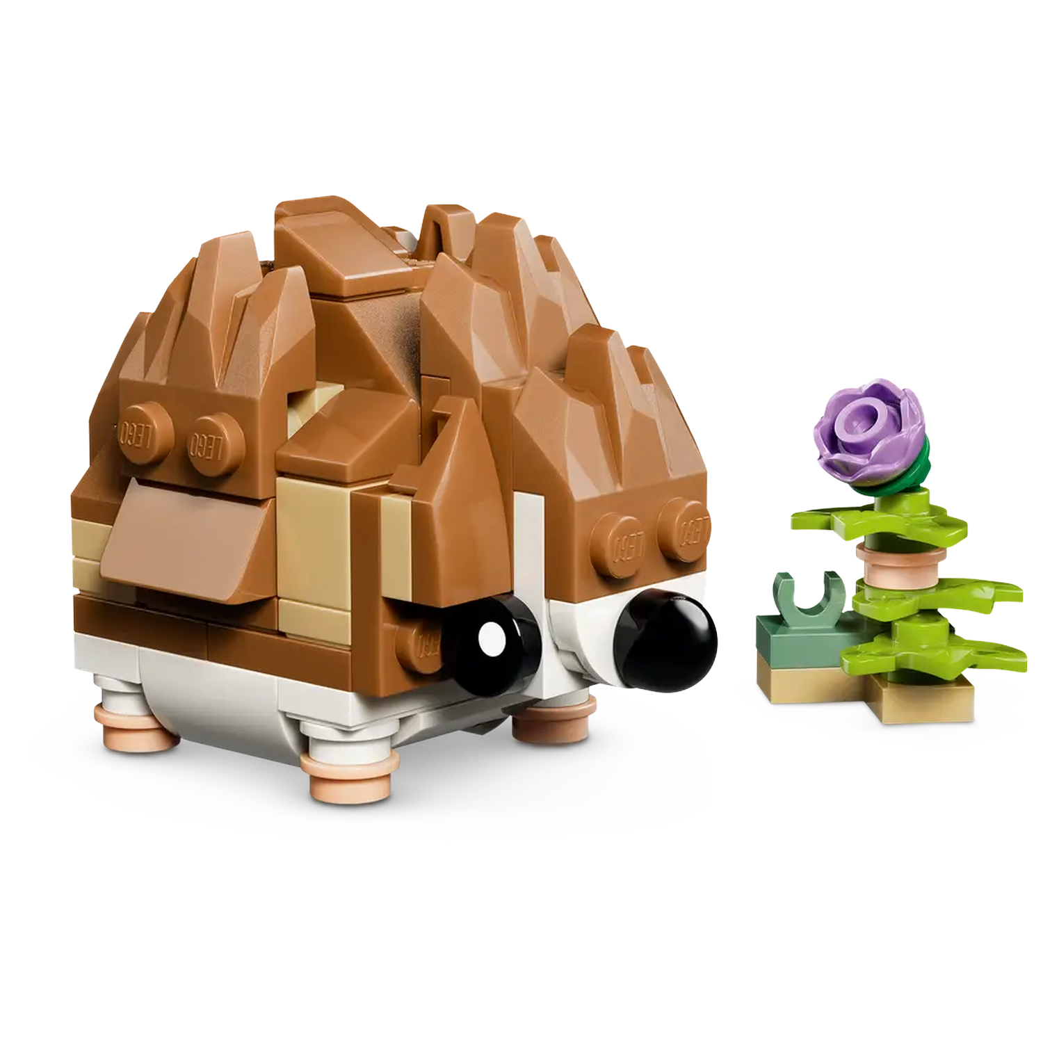 A Lego hedgehog with brown spikes, black eyes, and a small flower next to it. The flower is purple with green leaves.