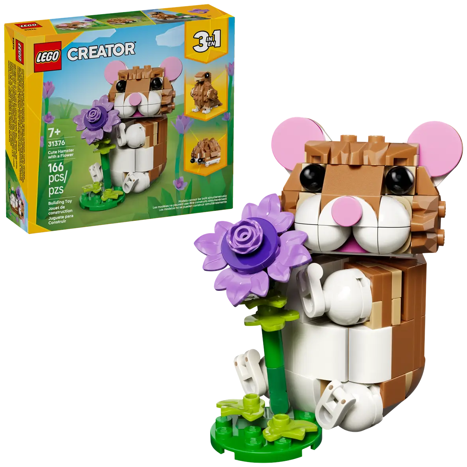 A Lego hamster with a purple flower. It is brown and white with pink ears. The background shows the box and other Lego models.
