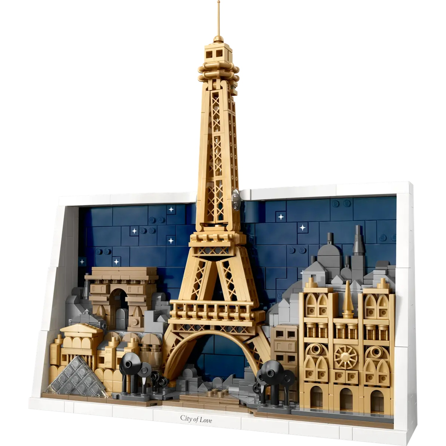 Lego model of Paris, including the Eiffel Tower, Arc de Triomphe, and Notre Dame, against a blue night sky background. City of Love.