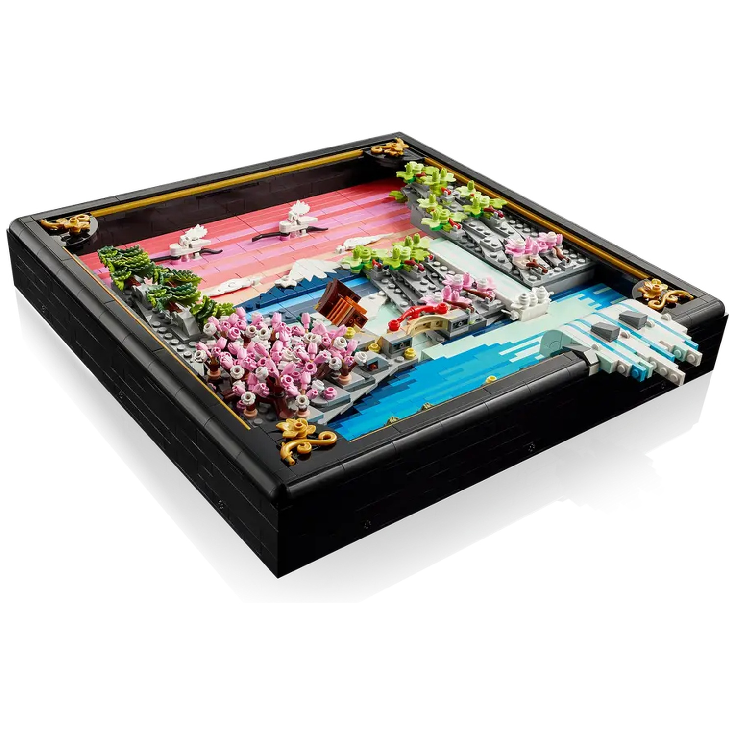 Lego diorama of a Japanese garden with cherry blossoms, a bridge, water, and mountains, set in a black frame.