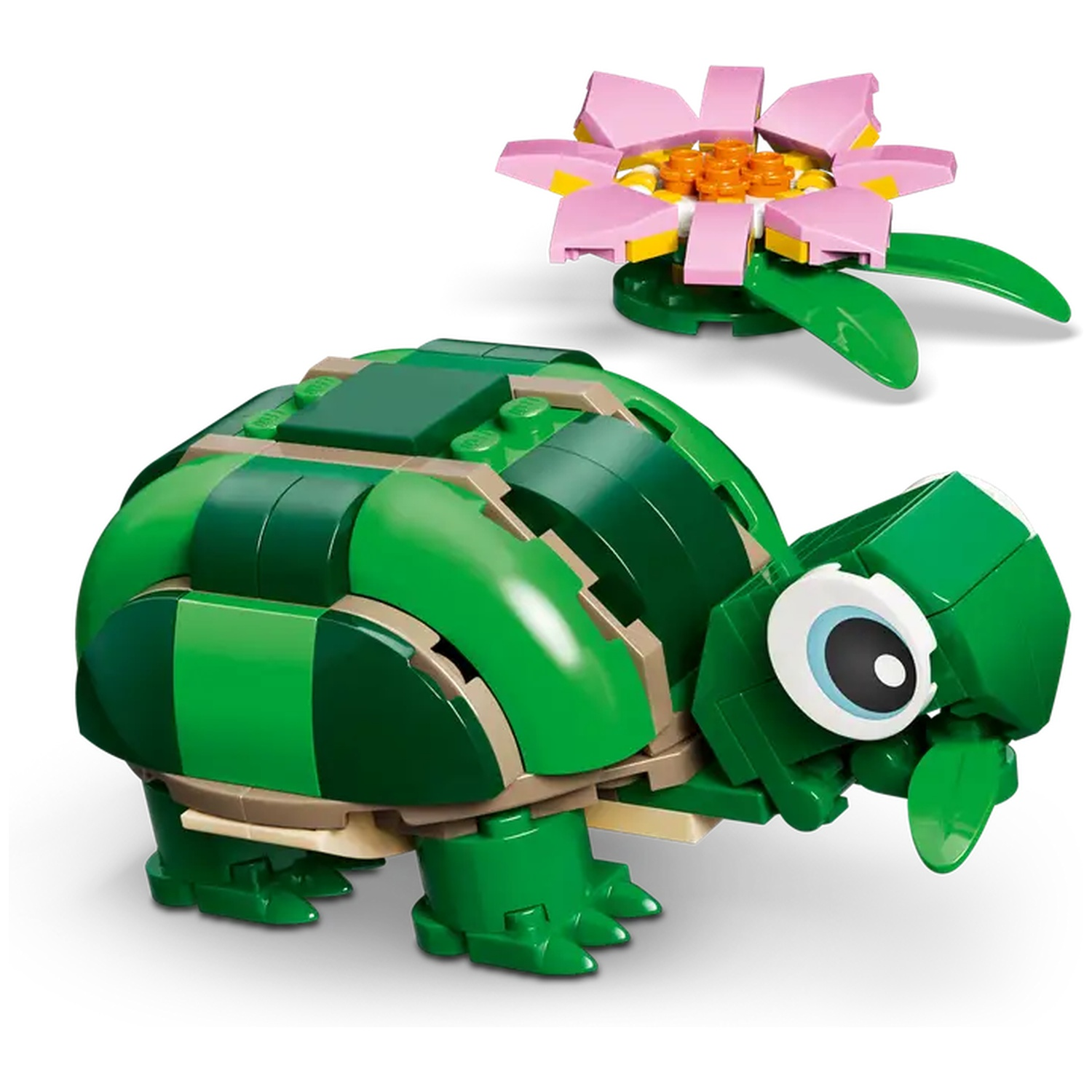 A Lego turtle and flower are on a white background. The turtle is green, with tan accents. The flower is pink, yellow, and green.