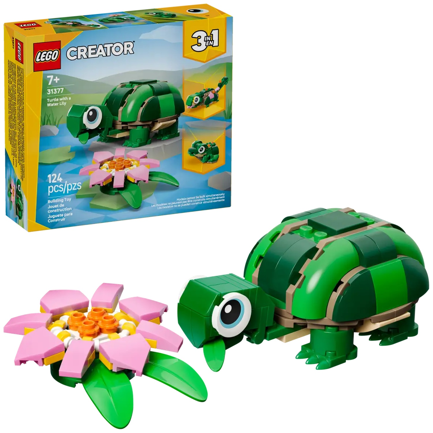 A Lego set featuring a green turtle, a pink and yellow flower, and the Lego box. The box shows the turtle, lily, and smaller turtle.