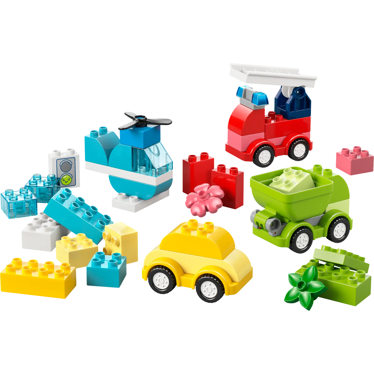 Des blocs de jouets colorés disposés en hélicoptère, camion de pompiers, voiture et camion. Divers blocs et une fleur.
