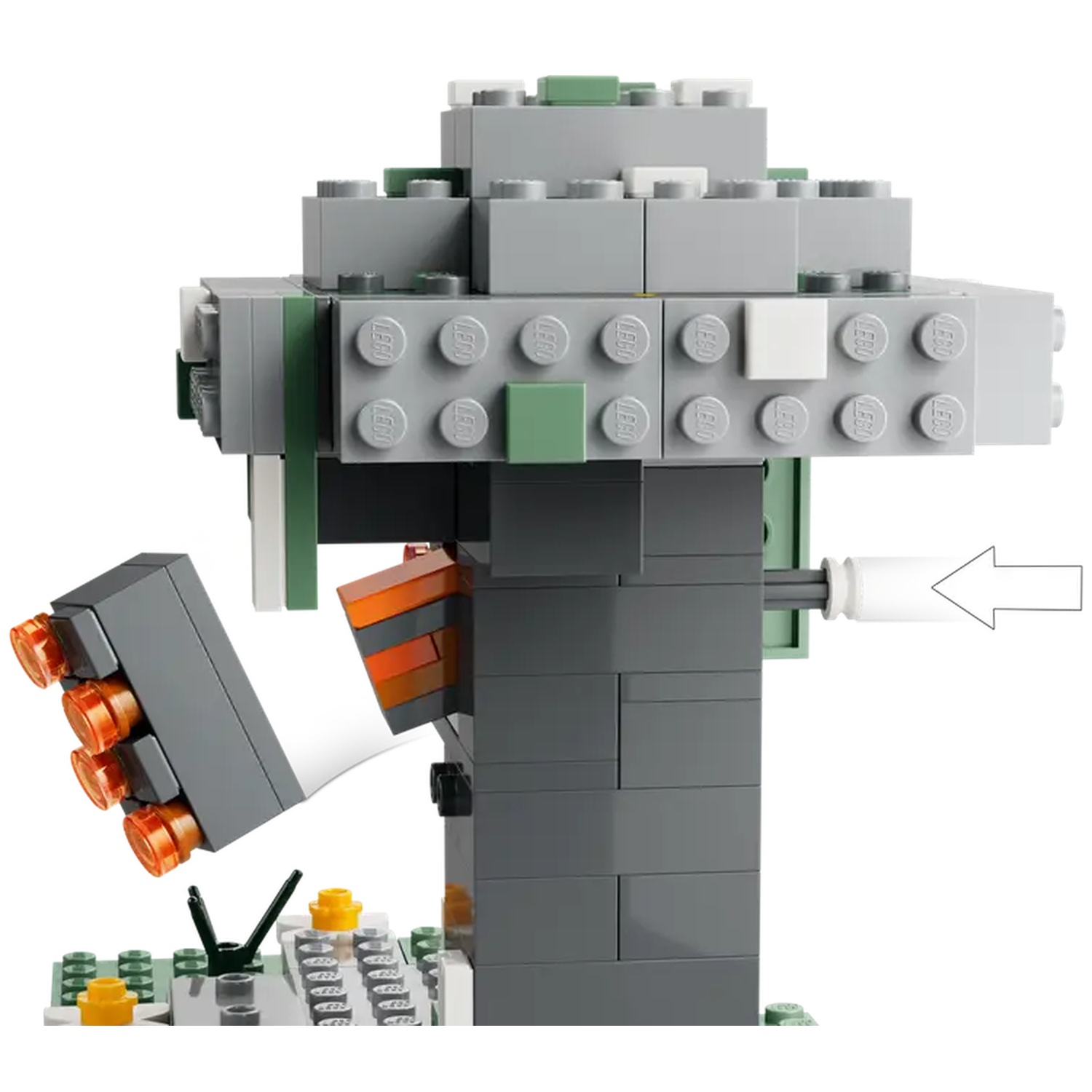 Une structure Lego avec des blocs gris, verts et orange. Une flèche pointe vers un cylindre blanc. La base a des pièces vertes et jaunes.