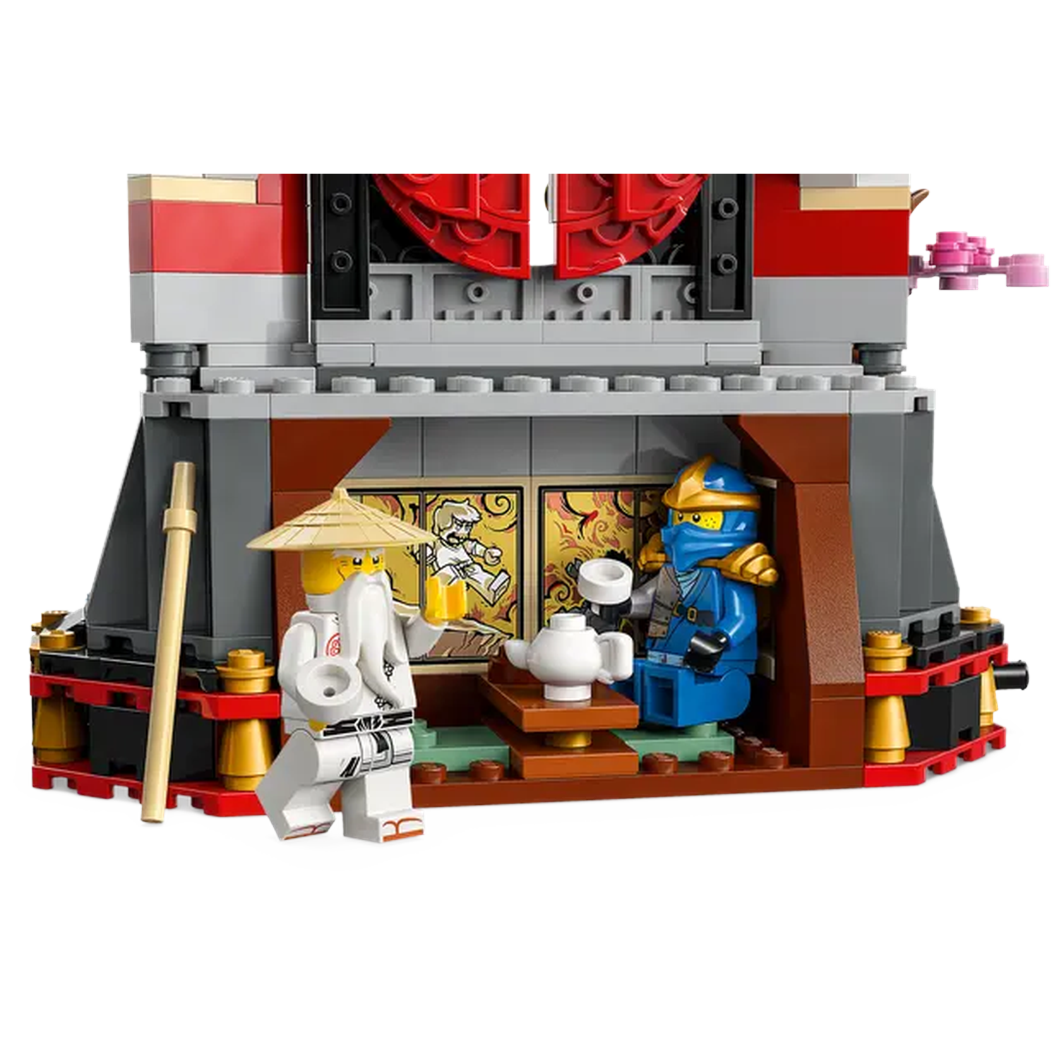 Lego set depicting a scene inside a building. Two minifigs are present, one holding a cup, and the other holding a teapot.