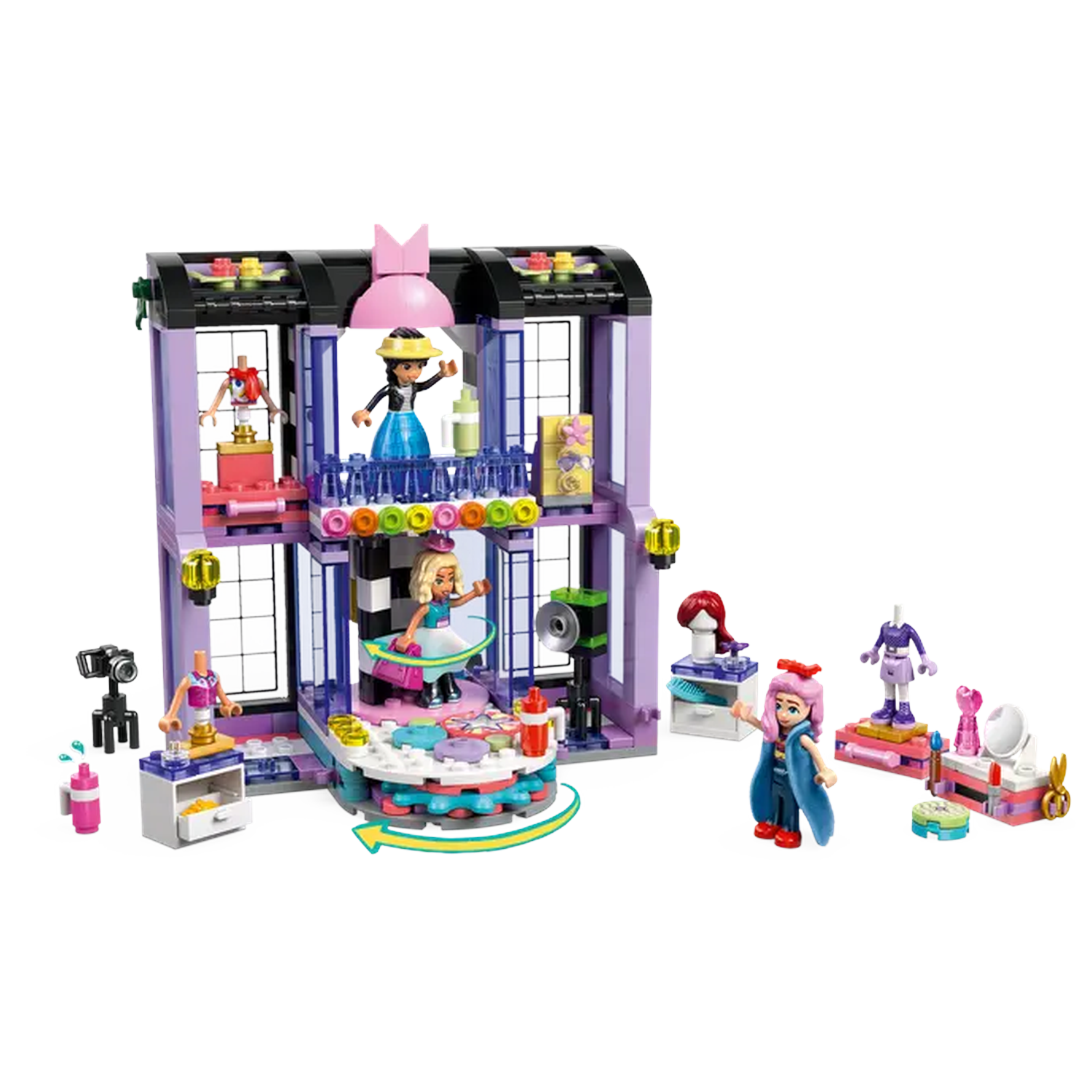 Lego set depicting a fashion show with multiple mini-figures, stage, fashion accessories, and building with purple accents.