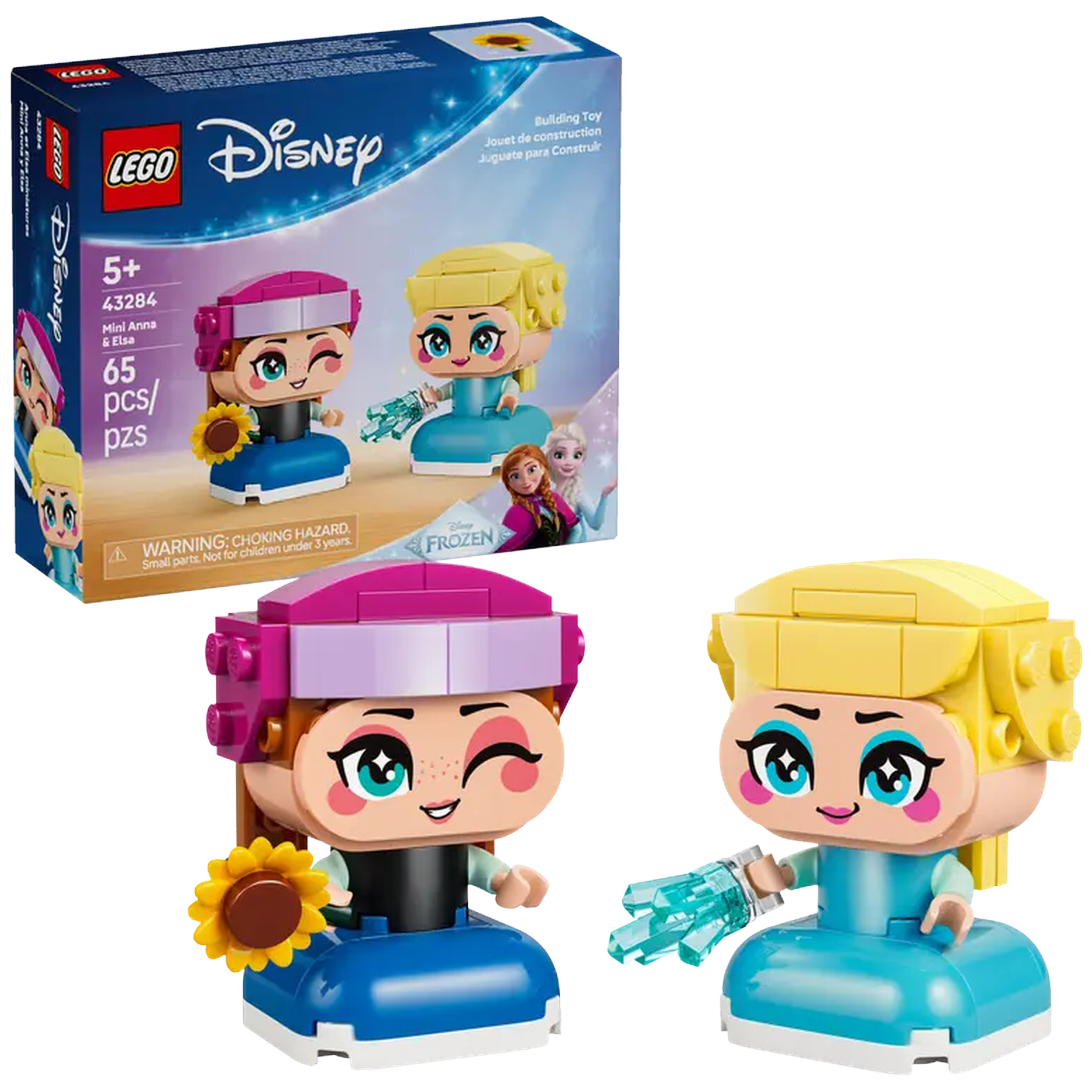 Lego Disney set features Anna and Elsa mini-figures. Anna holds a sunflower, and Elsa has an ice crystal. A box is in the background.