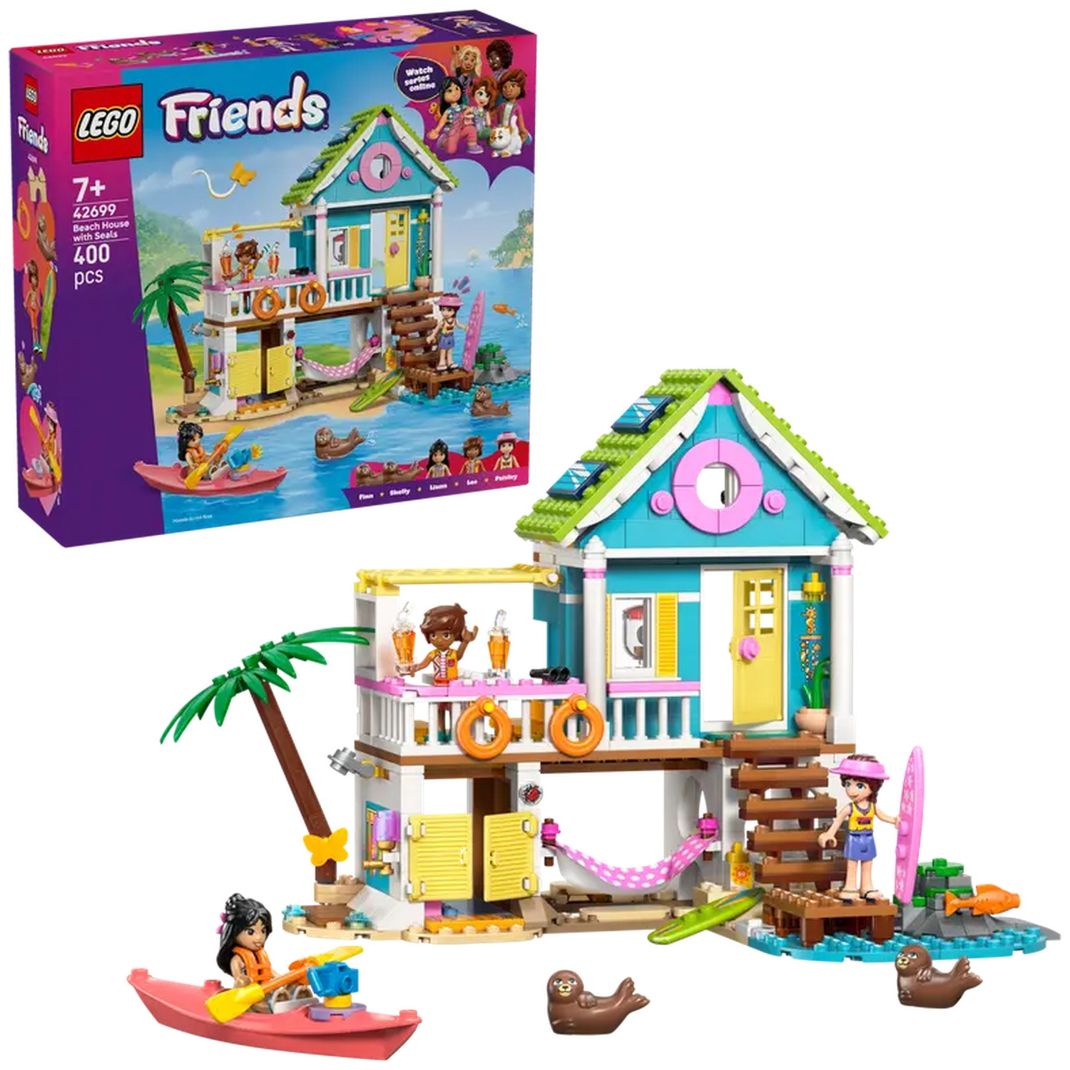 LEGO Friends Beach House set. Features a two-story house, figures, kayaks, surfboards, seals, and accessories. A box is on the left.