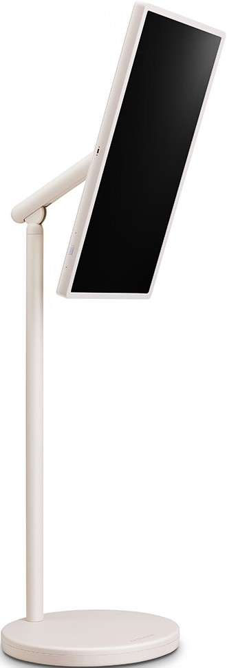 Un monitor beige su un supporto. Lo schermo è nero. Il supporto ha una base rotonda e un palo verticale.