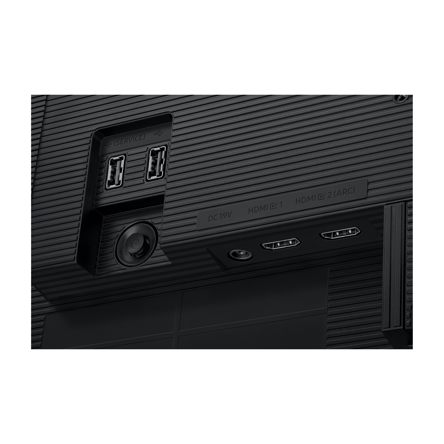 Primo piano del retro di un monitor nero con porte. Mostra porte USB, HDMI e di alimentazione. La superficie ha un motivo a coste.