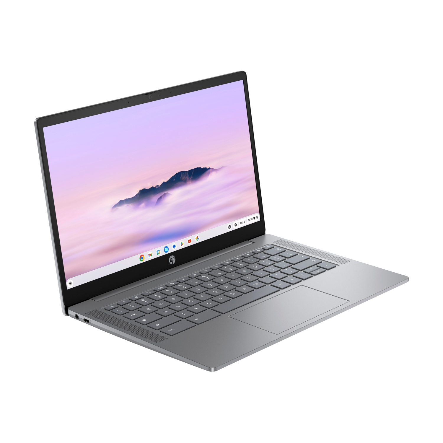 Un laptop HP grigio è aperto, leggermente angolato. Lo schermo mostra una scena di montagna. Tastiera e touchpad sono visibili. Sfondo bianco.