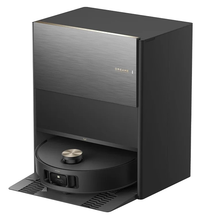 Czarny robot sprzątający jest zadokowany w swojej stacji ładującej, która ma szczotkowany metalowy blat.