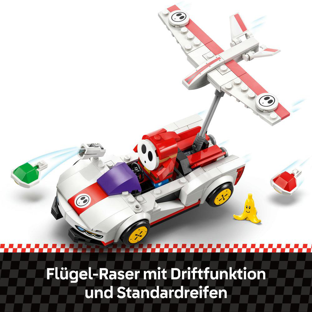 Ein Spielzeugauto mit Flügel, ein rot-weißes Flugzeug und eine Banane. Es gibt zwei grüne und rote Bomben.