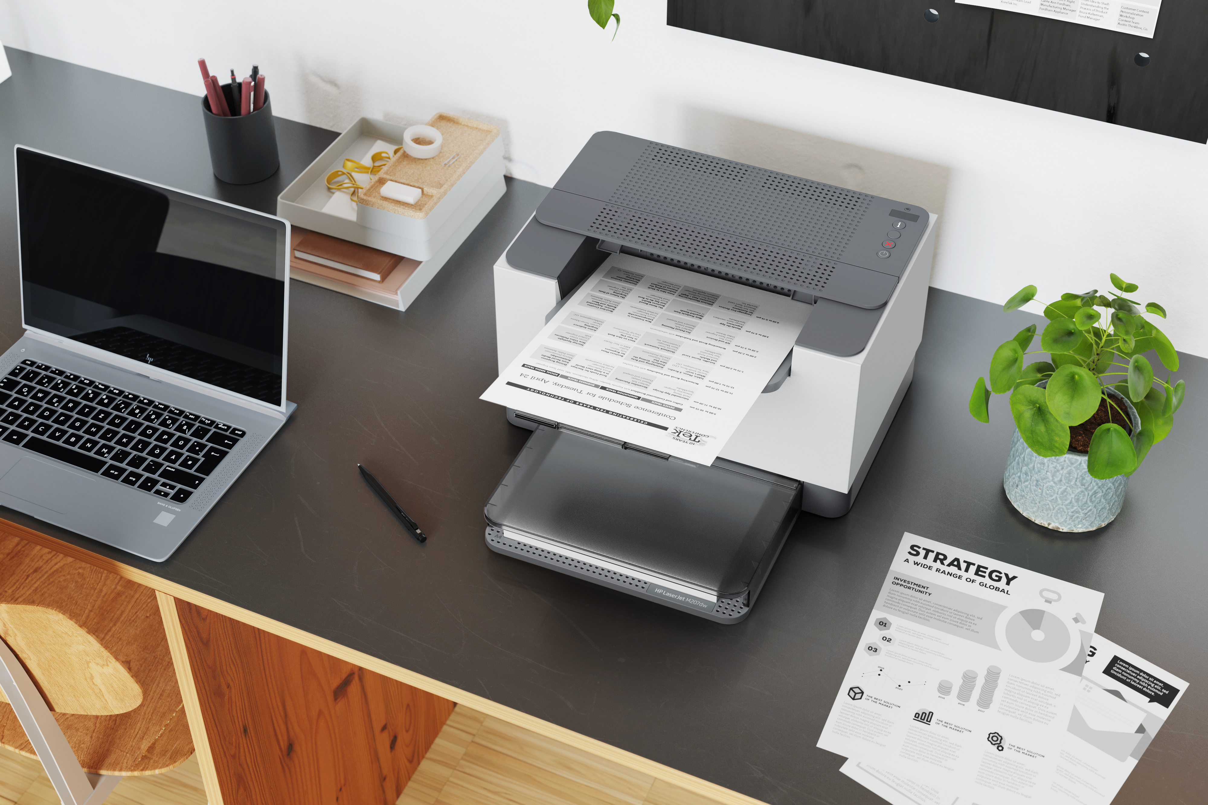 Bureau-opstelling met laptop, printer en kantoorbenodigdheden.
