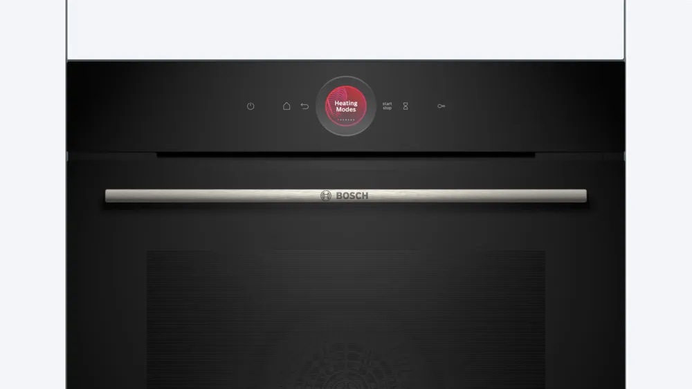 Horno negro Bosch con asa plateada. Pantalla roja con modos de calentamiento. Arriba botones y panel blanco.