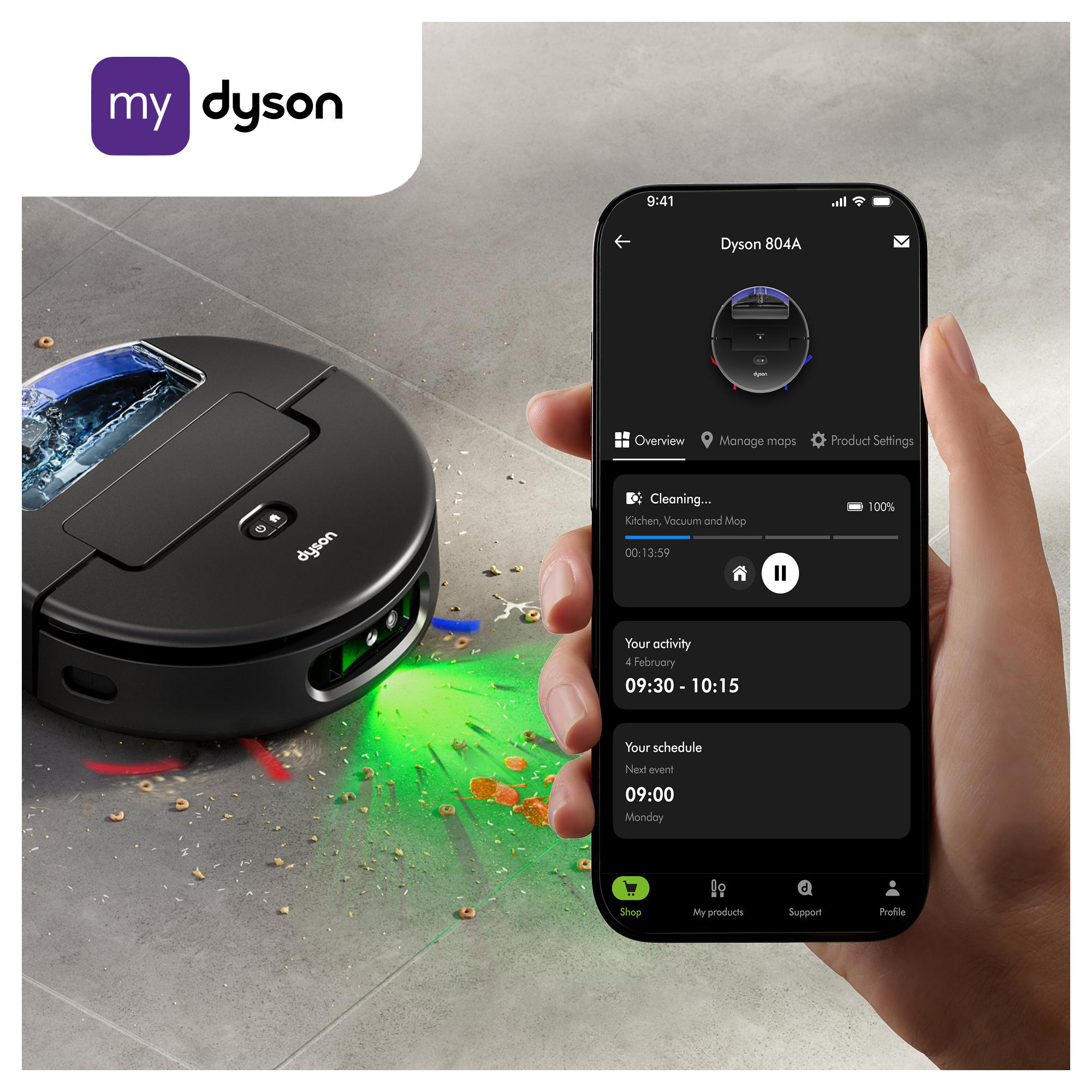 Ein Dyson-Roboter-Staubsauger und ein Telefon, das seine App anzeigt, reinigen einen Boden mit Krümeln.