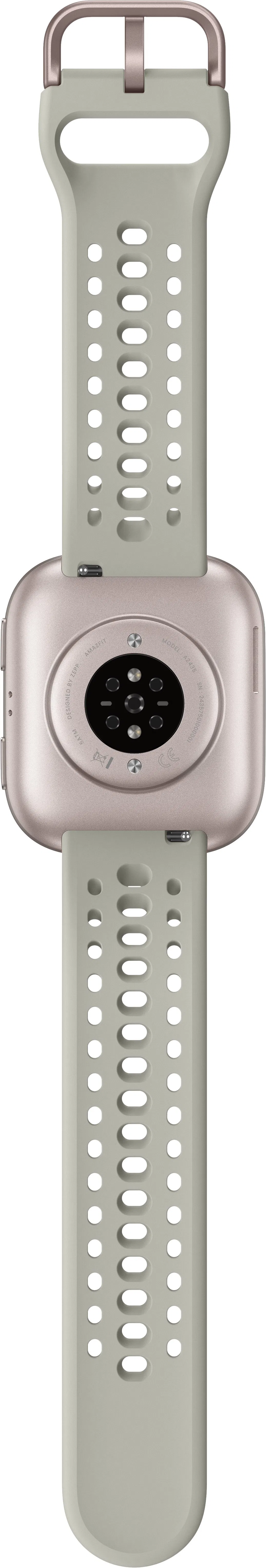 Rückseite einer Smartwatch mit Sensoren und zwei Armbändern. Die Armbänder sind hellgrün mit ovalen Löchern.